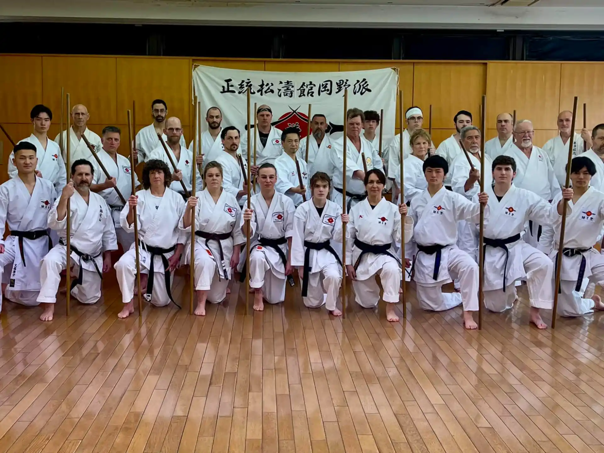 a group of people in karate uniforms