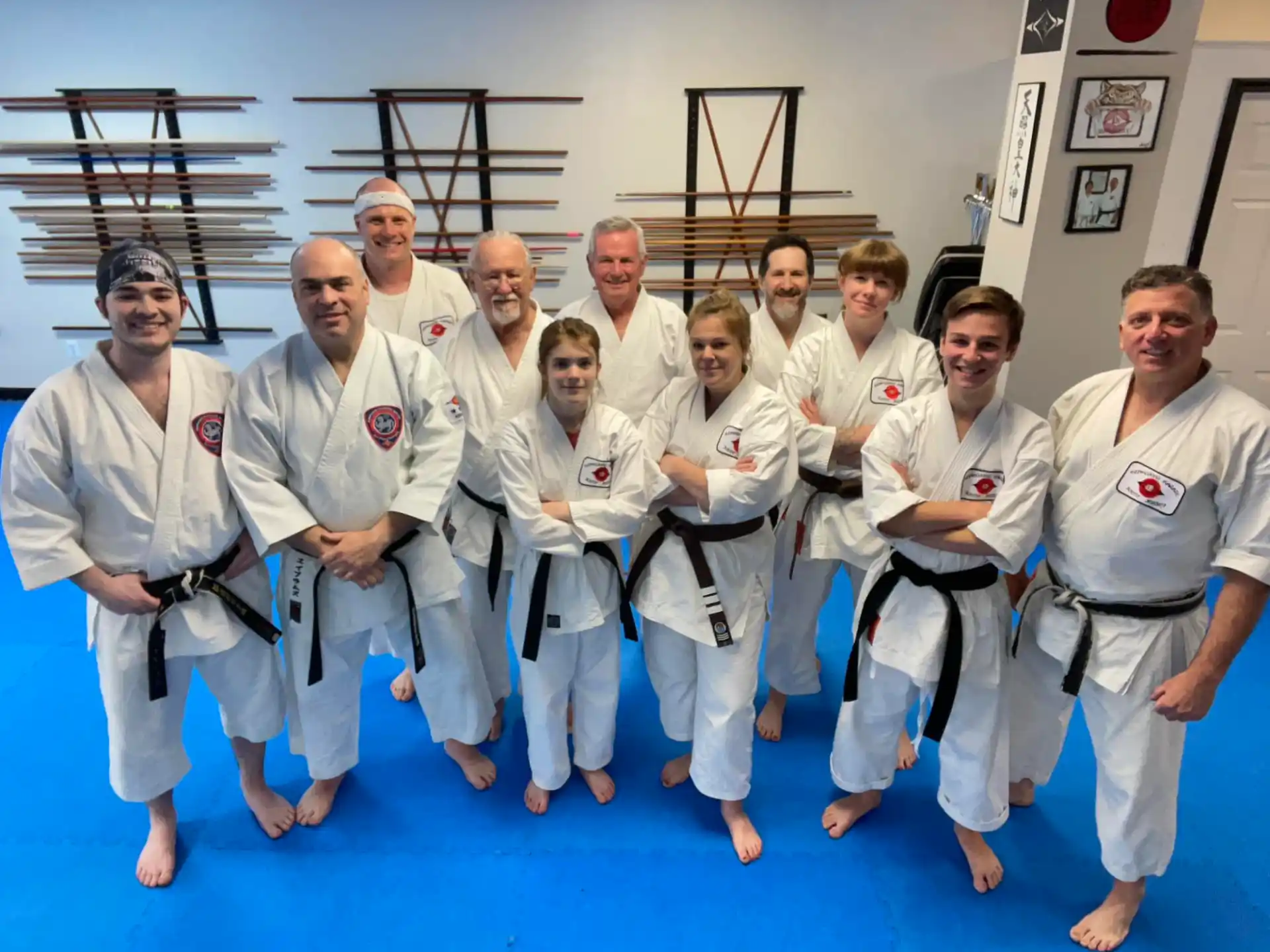 a group of people in white karate uniforms