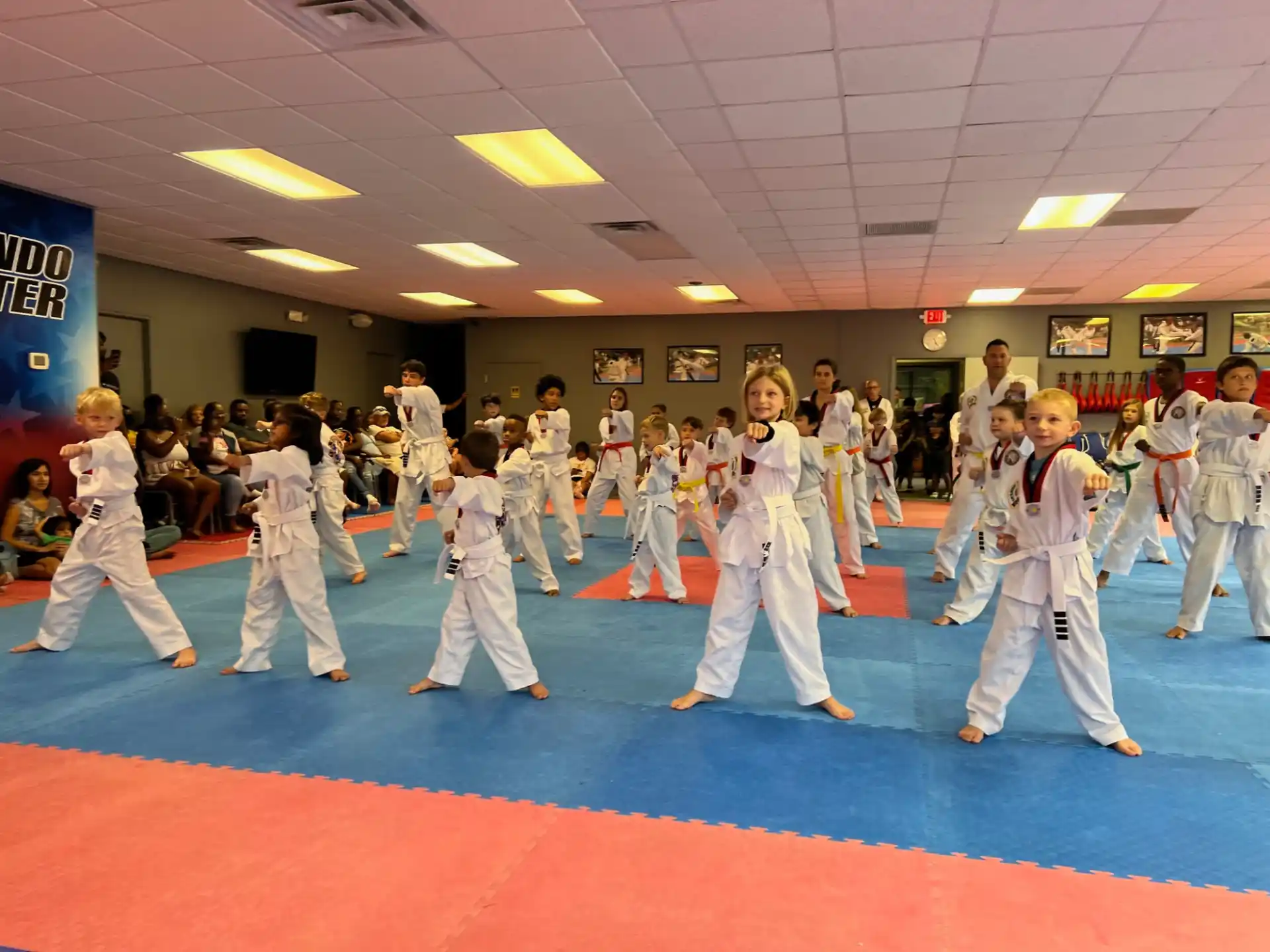 a group of people in karate uniforms