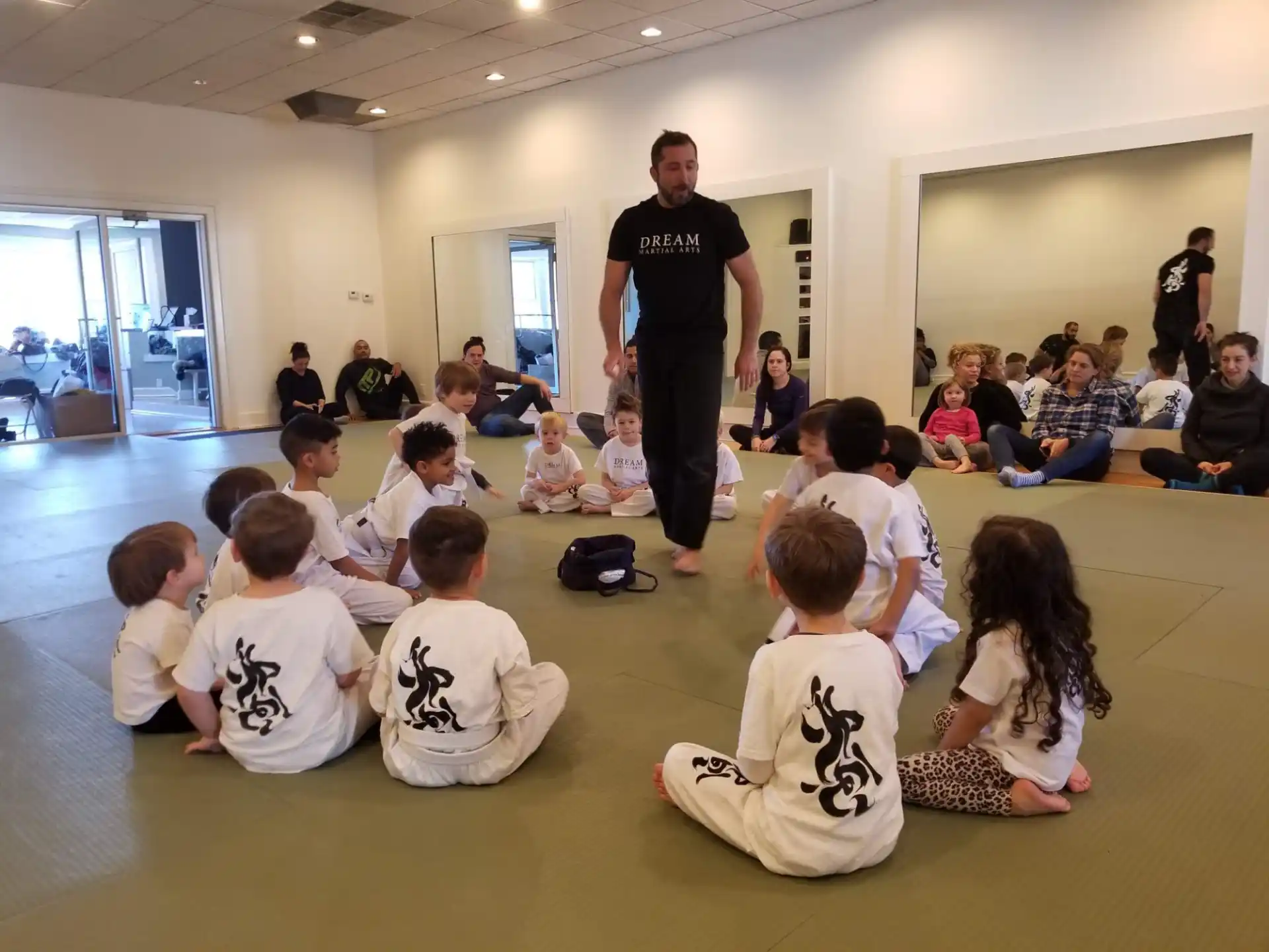 a person addressing a group of children