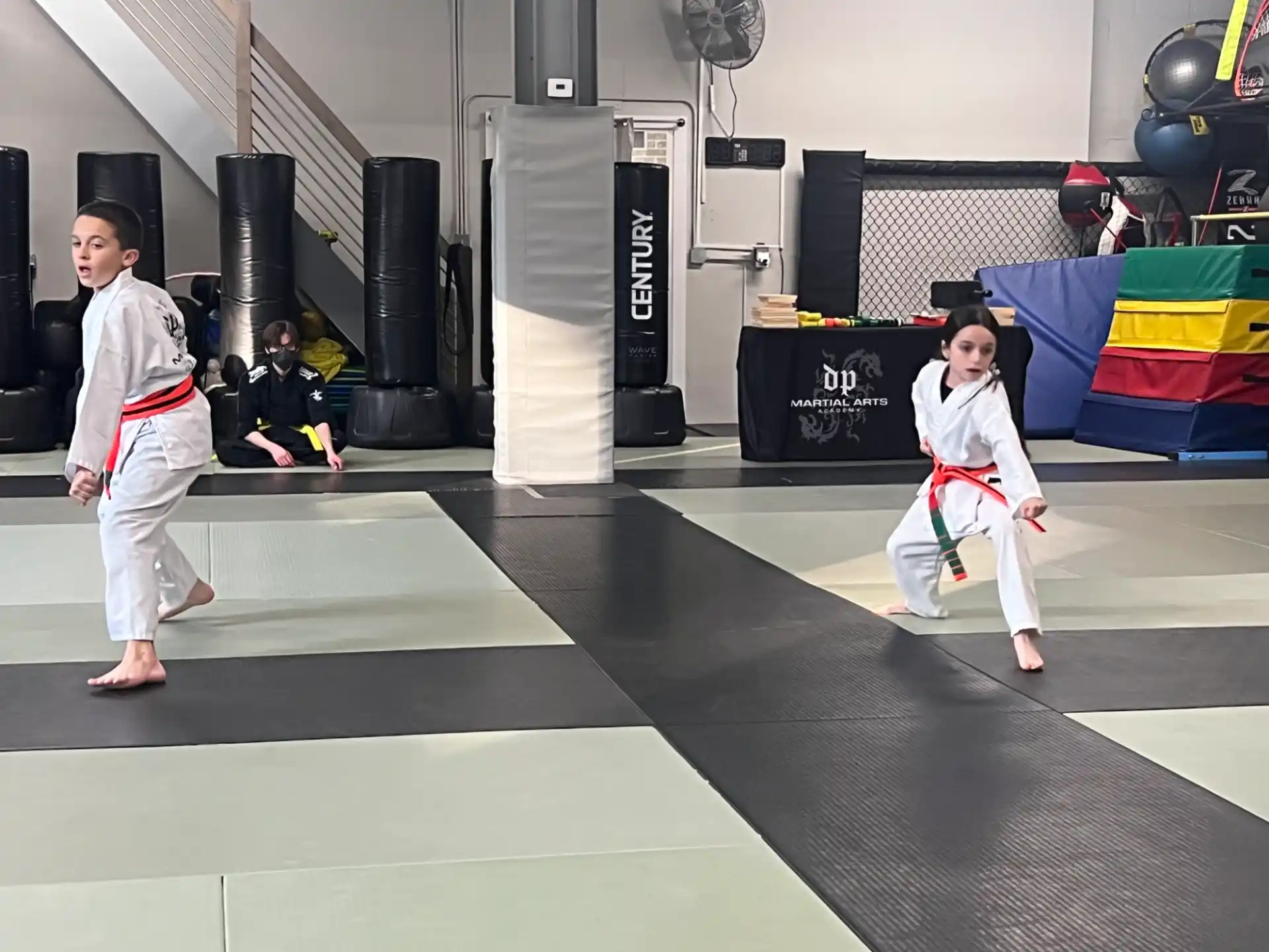 a couple of people in karate uniforms