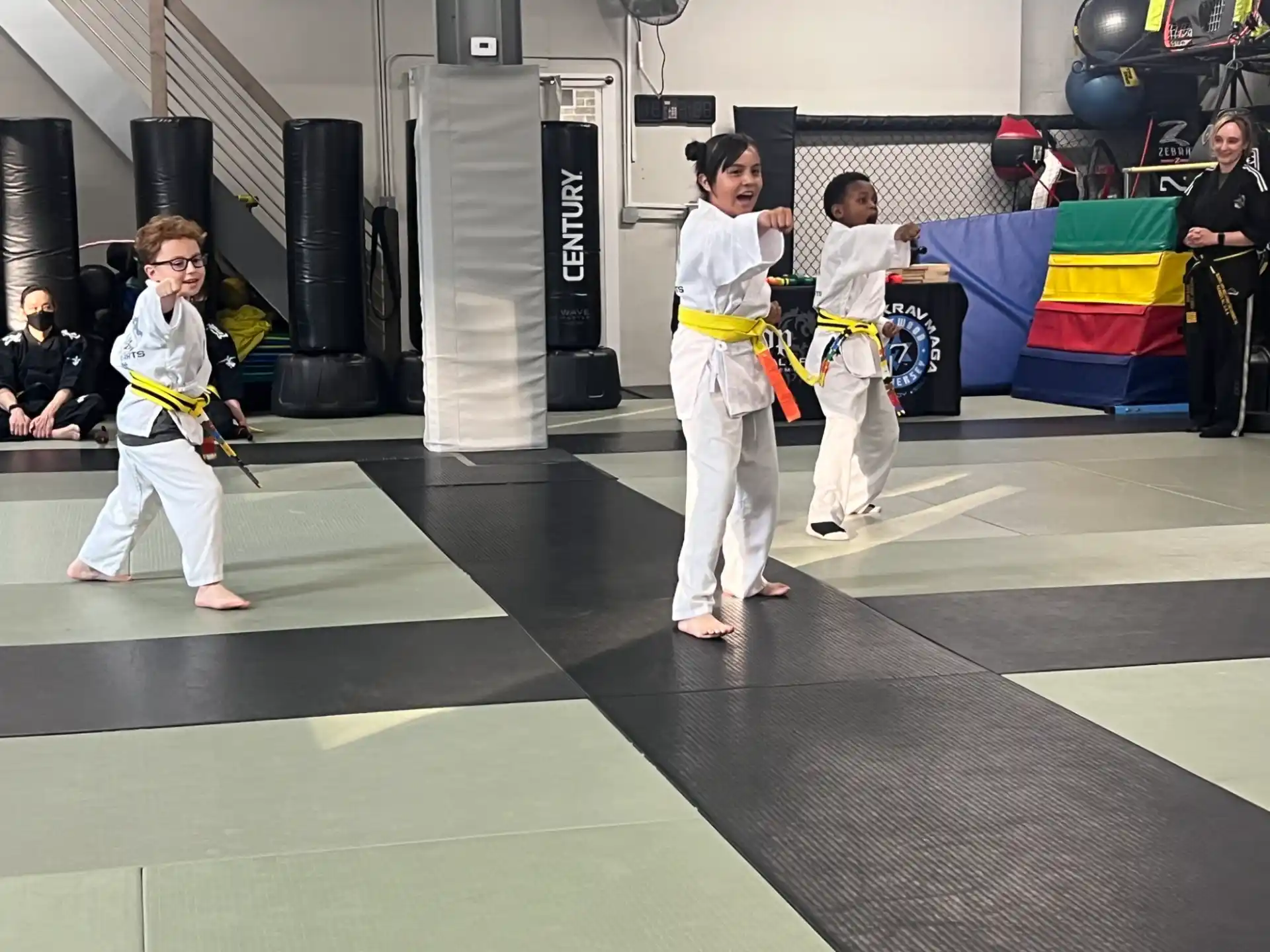 a group of people in karate uniforms