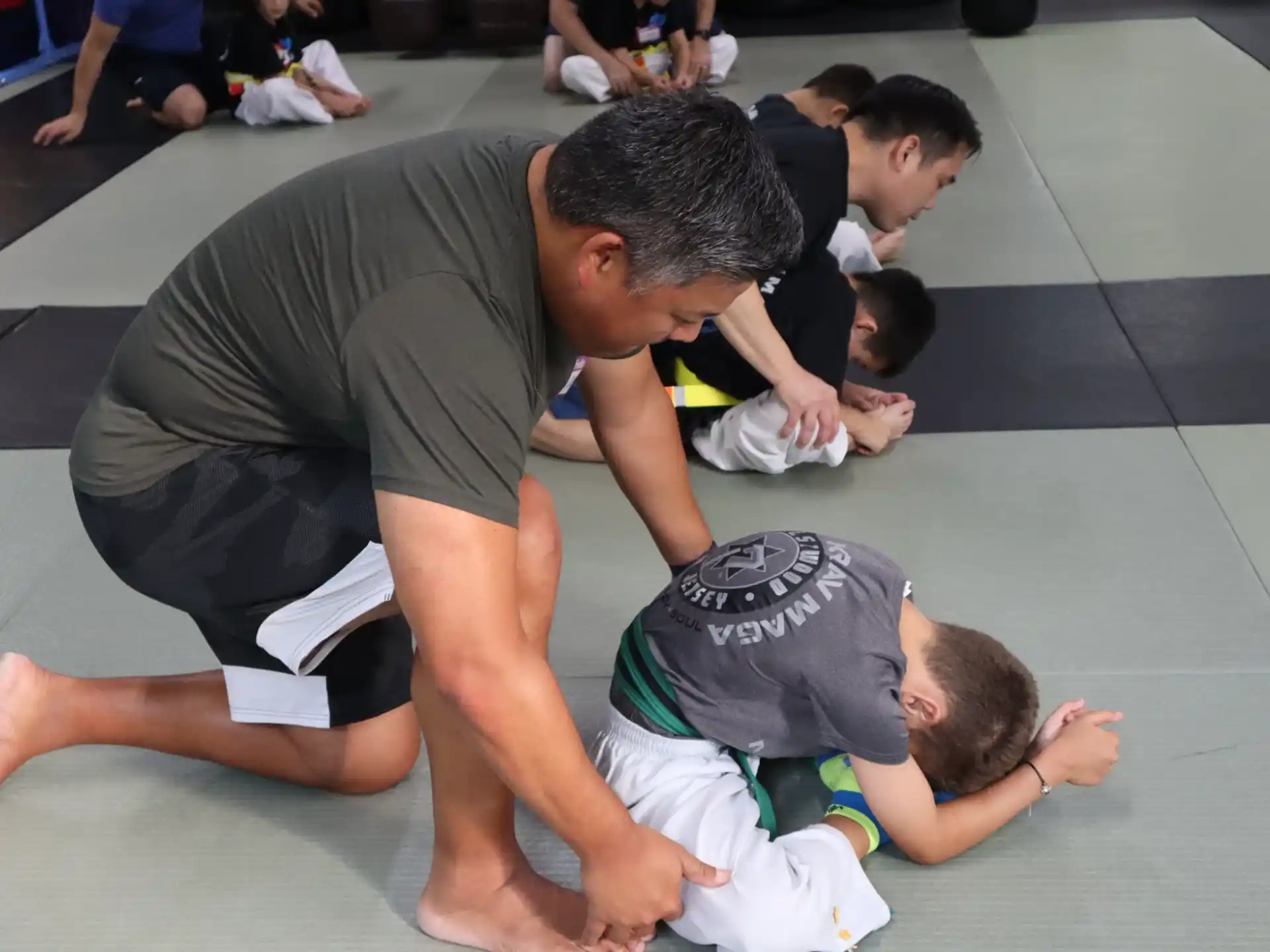 a group of people kneeling on the ground