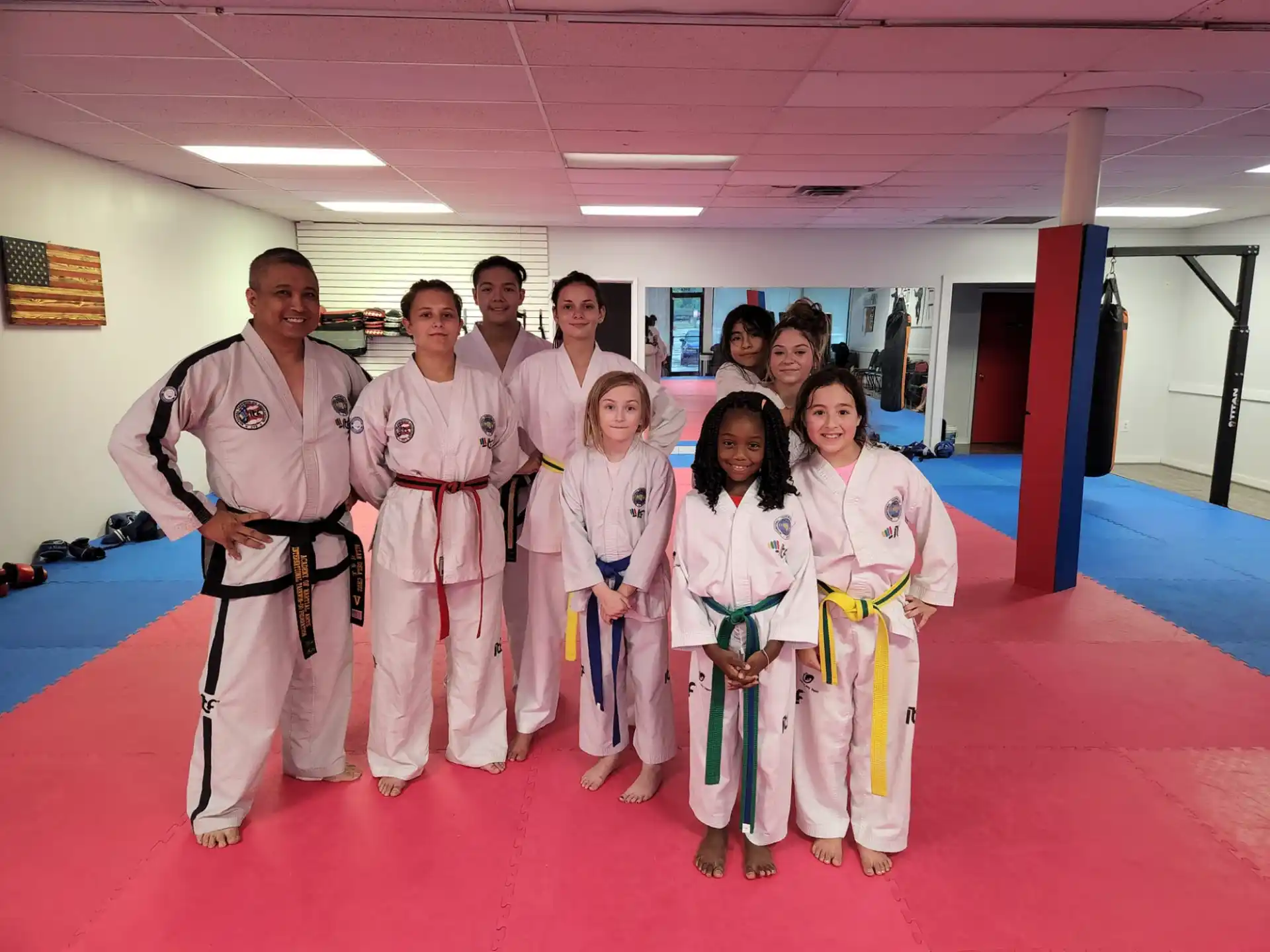 a group of people in karate uniforms