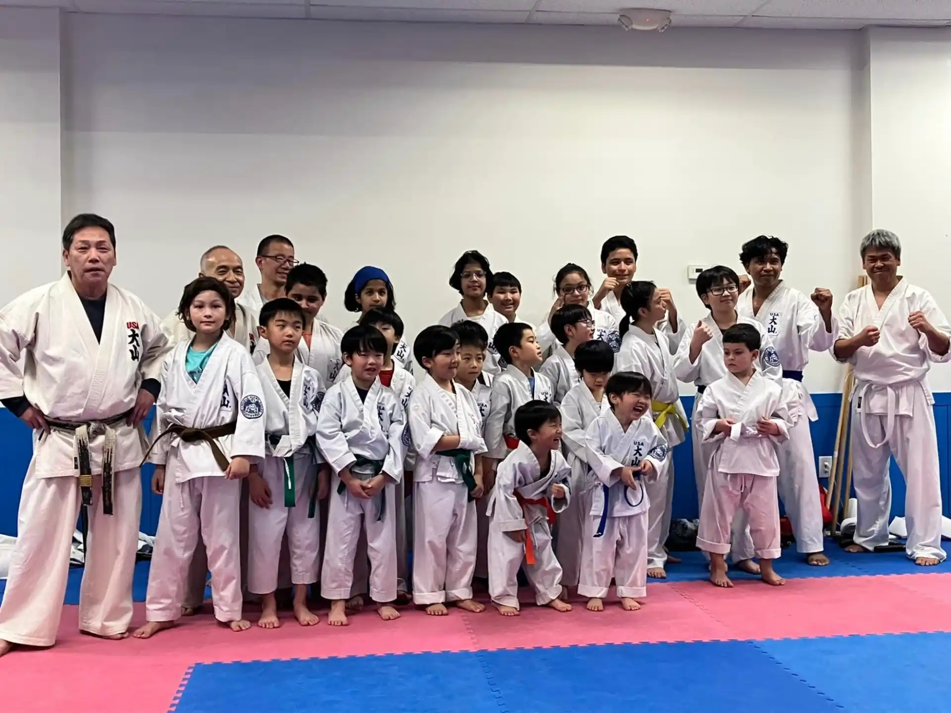 a group of people in karate uniforms