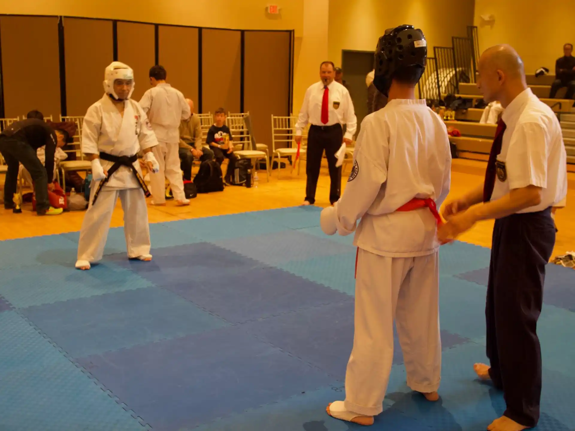 a group of people in karate uniforms