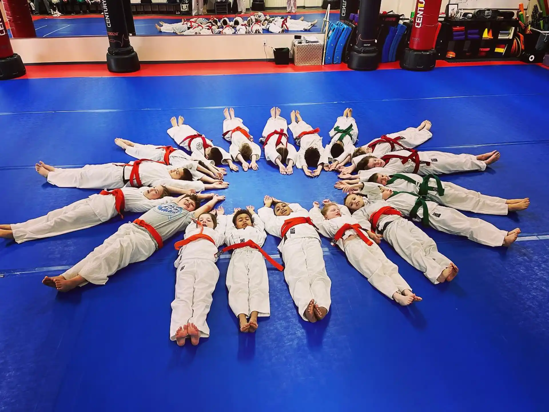 a group of people in karate uniforms