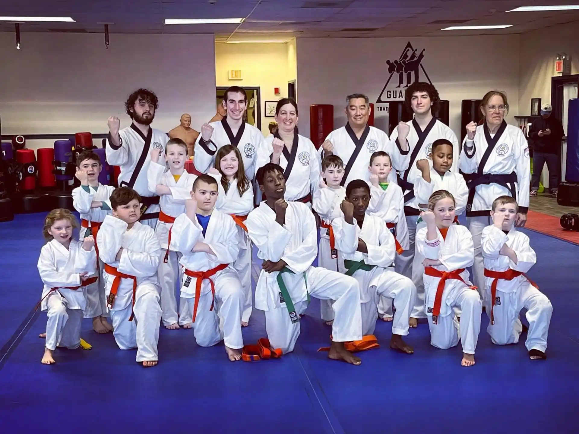 a group of people in karate uniforms
