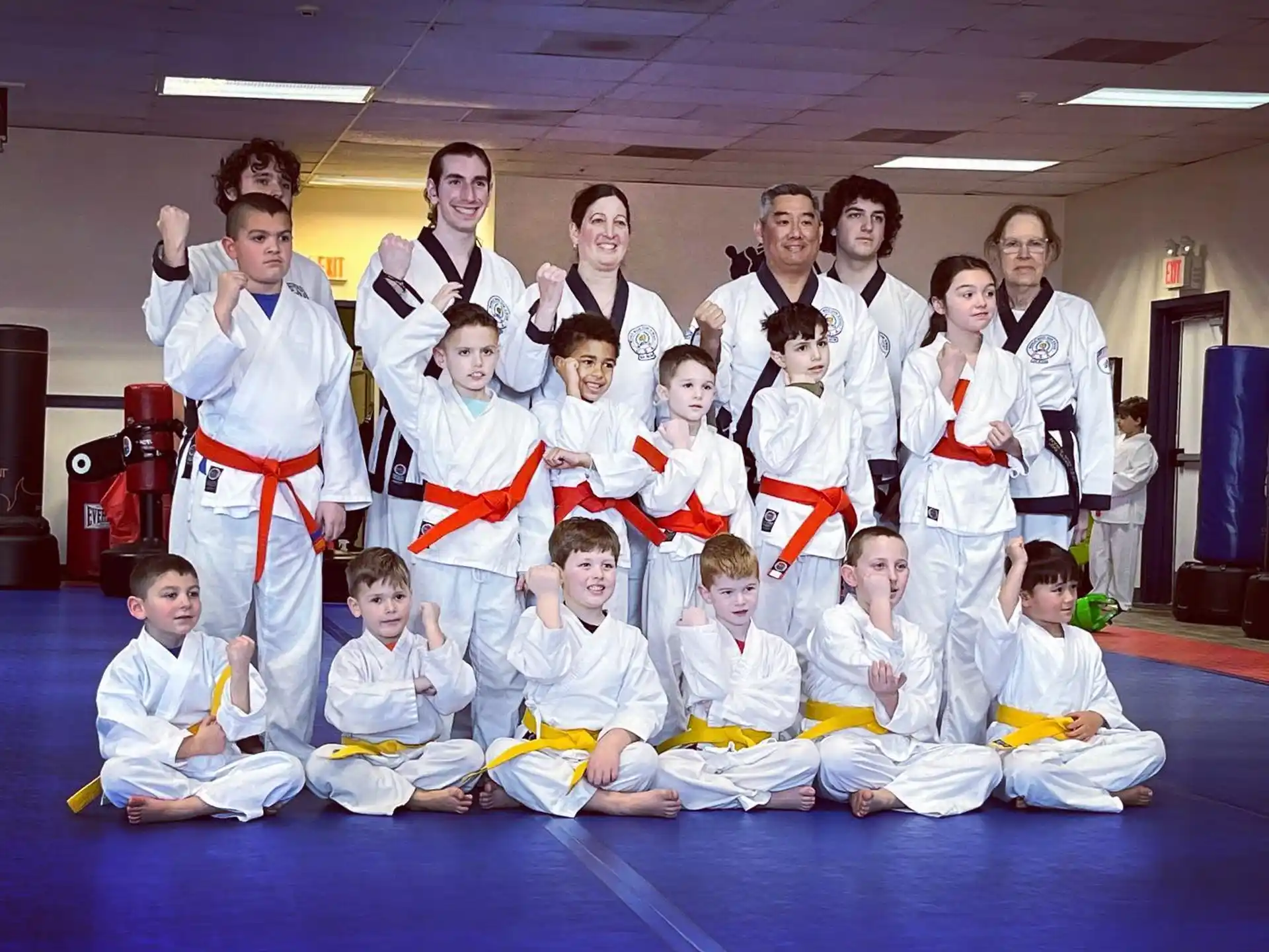 a group of people in karate uniforms