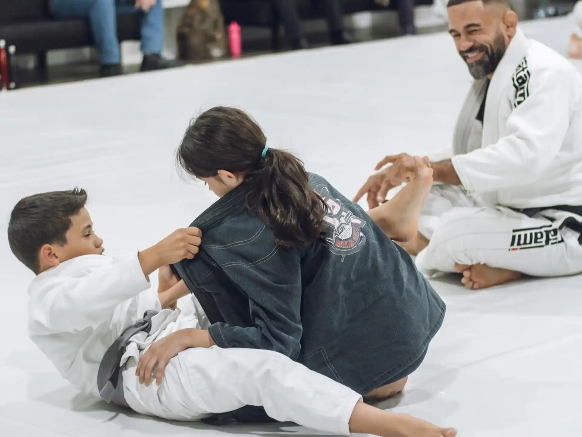 a man and a woman in karate uniforms