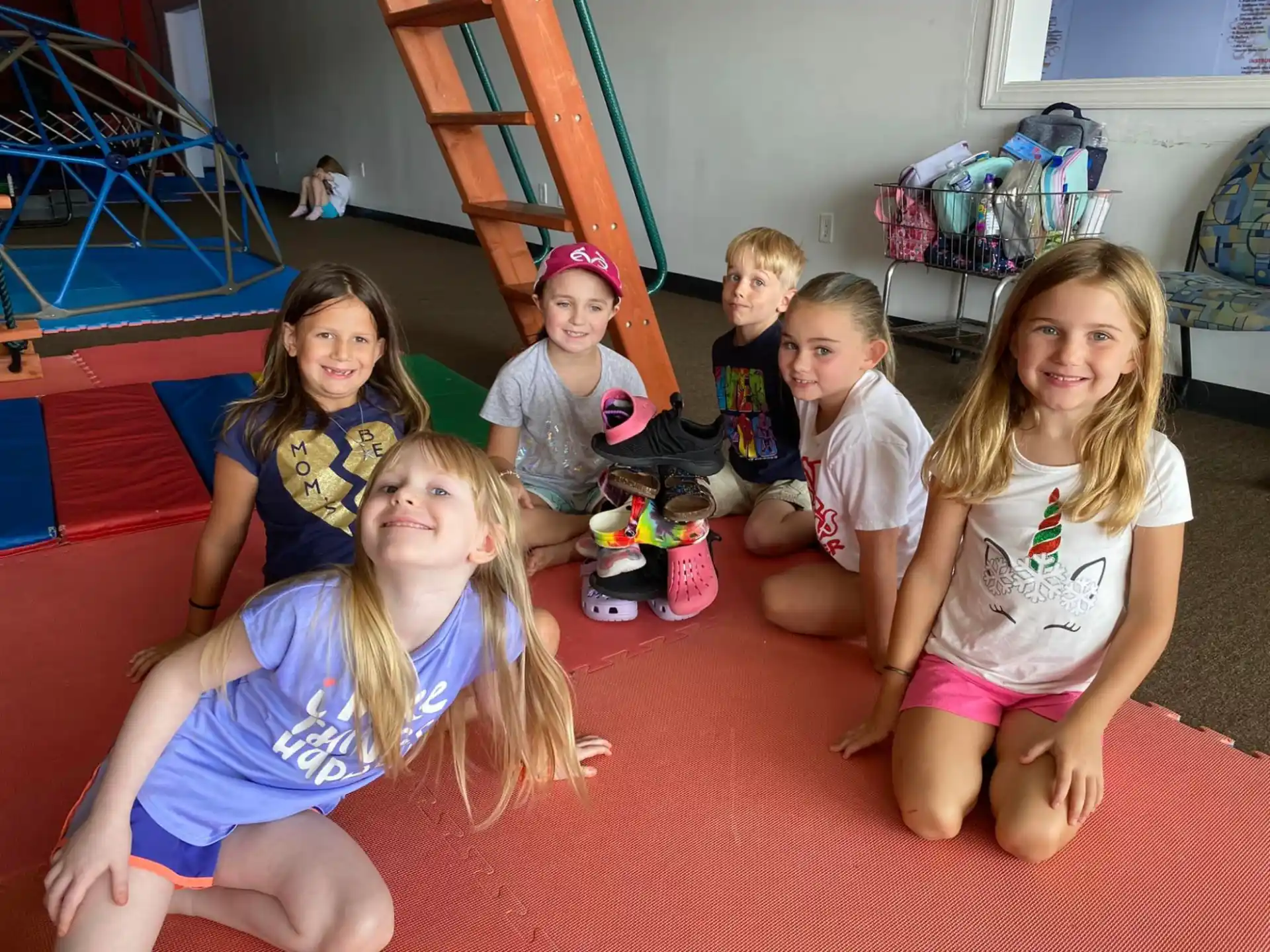 a group of children sitting on the floor