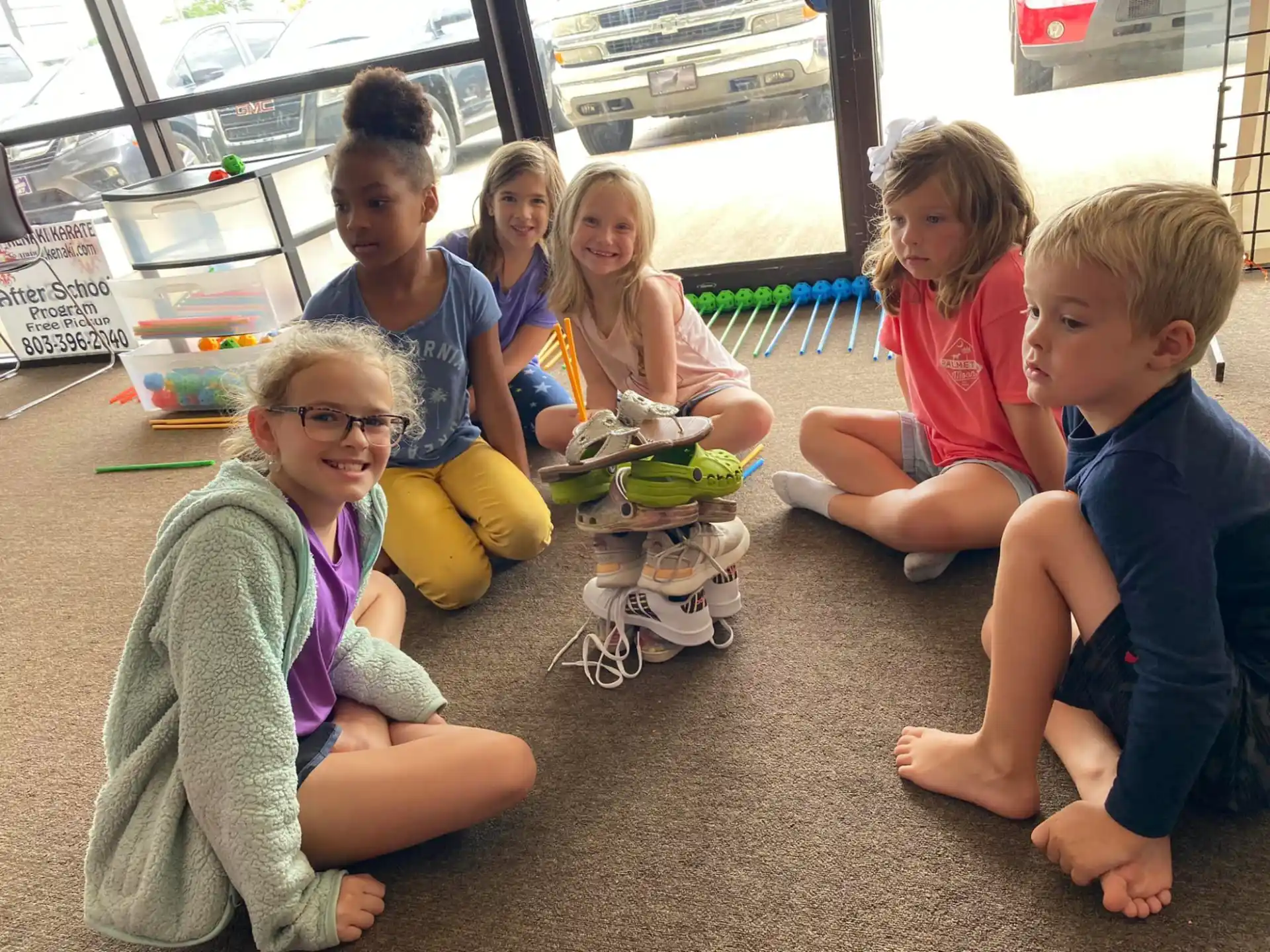 a group of children sitting on the floor