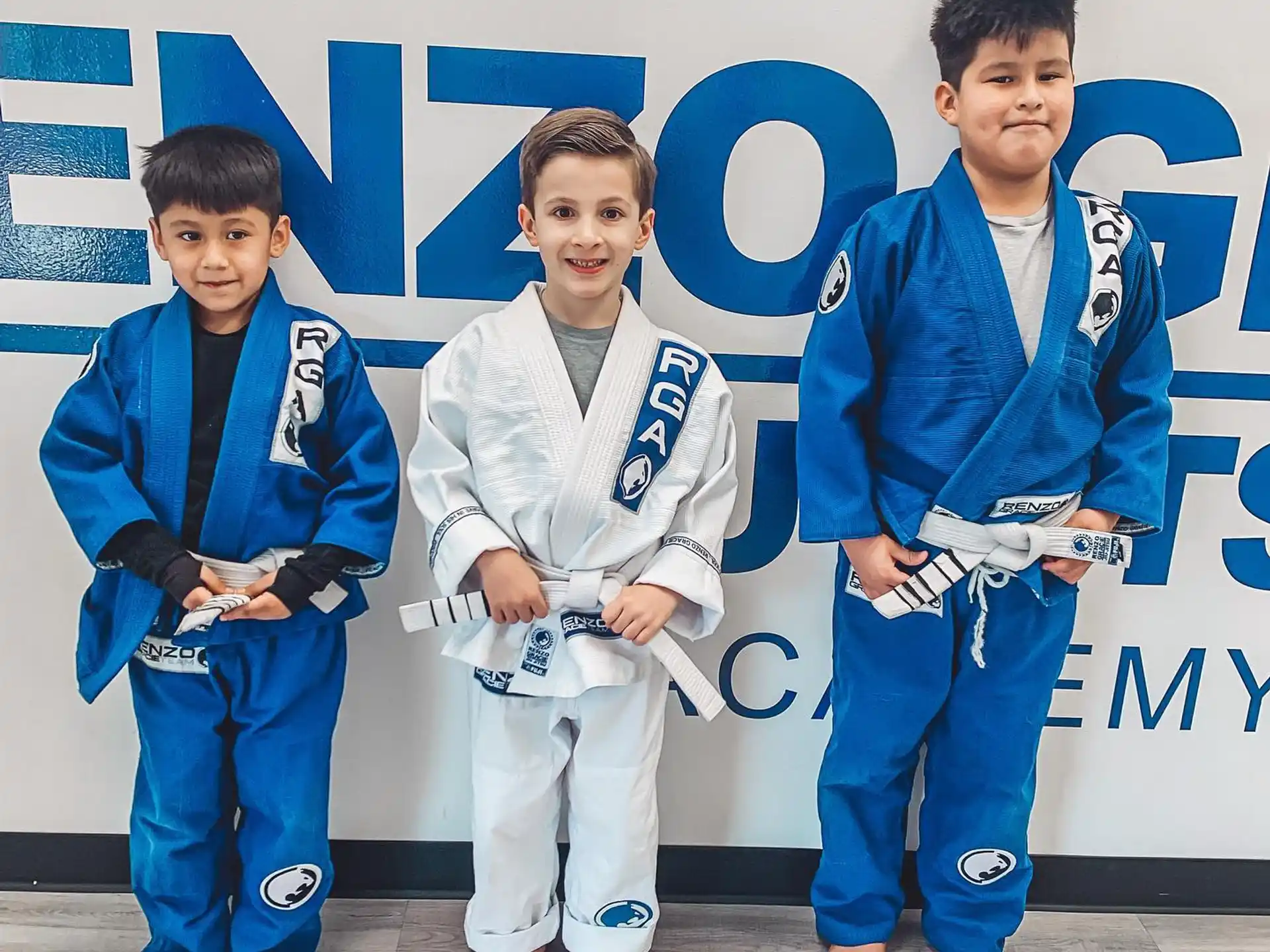a group of boys in karate uniforms
