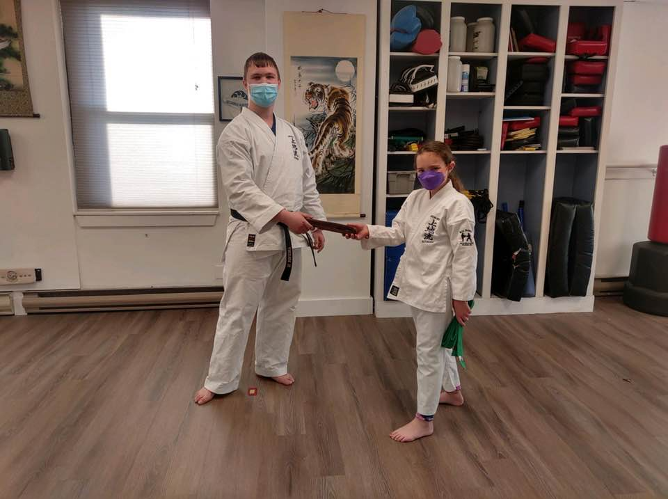 a person and a girl wearing masks