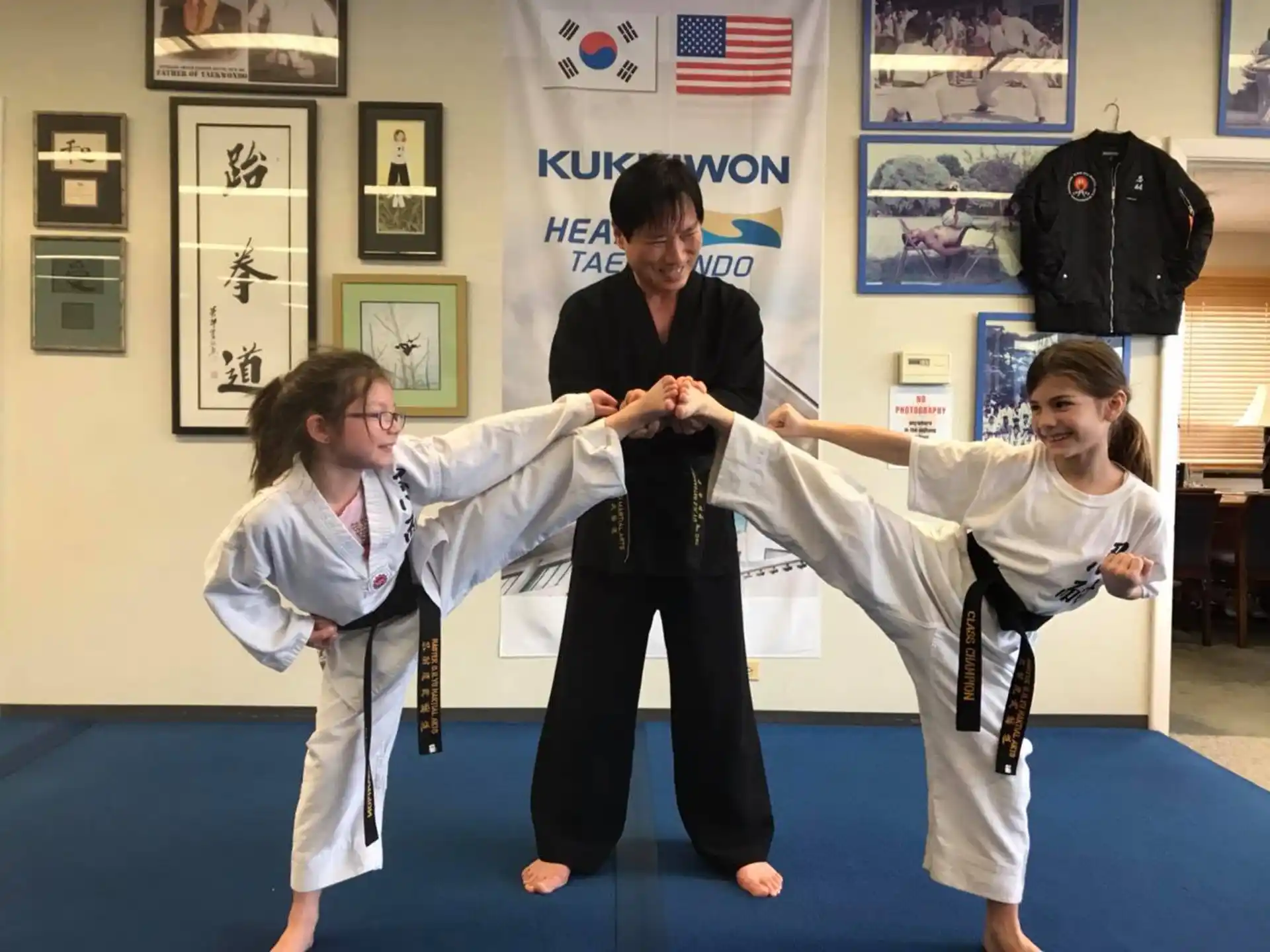 a group of people in karate uniforms