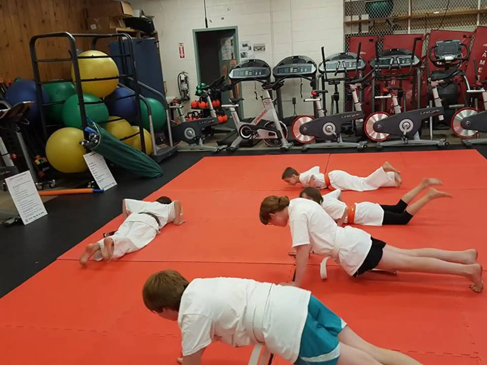 a group of people in a gym
