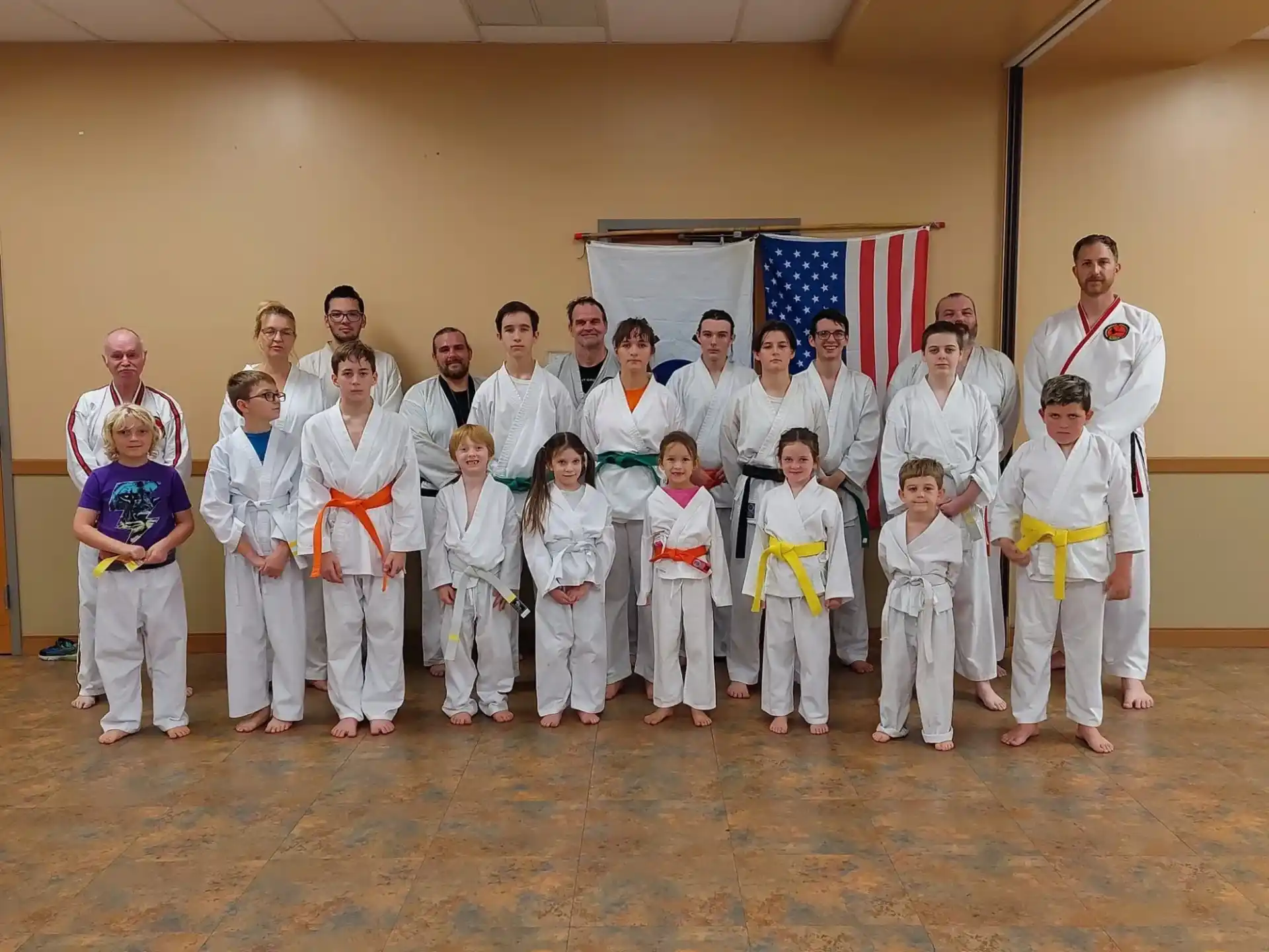 a group of people in karate uniforms