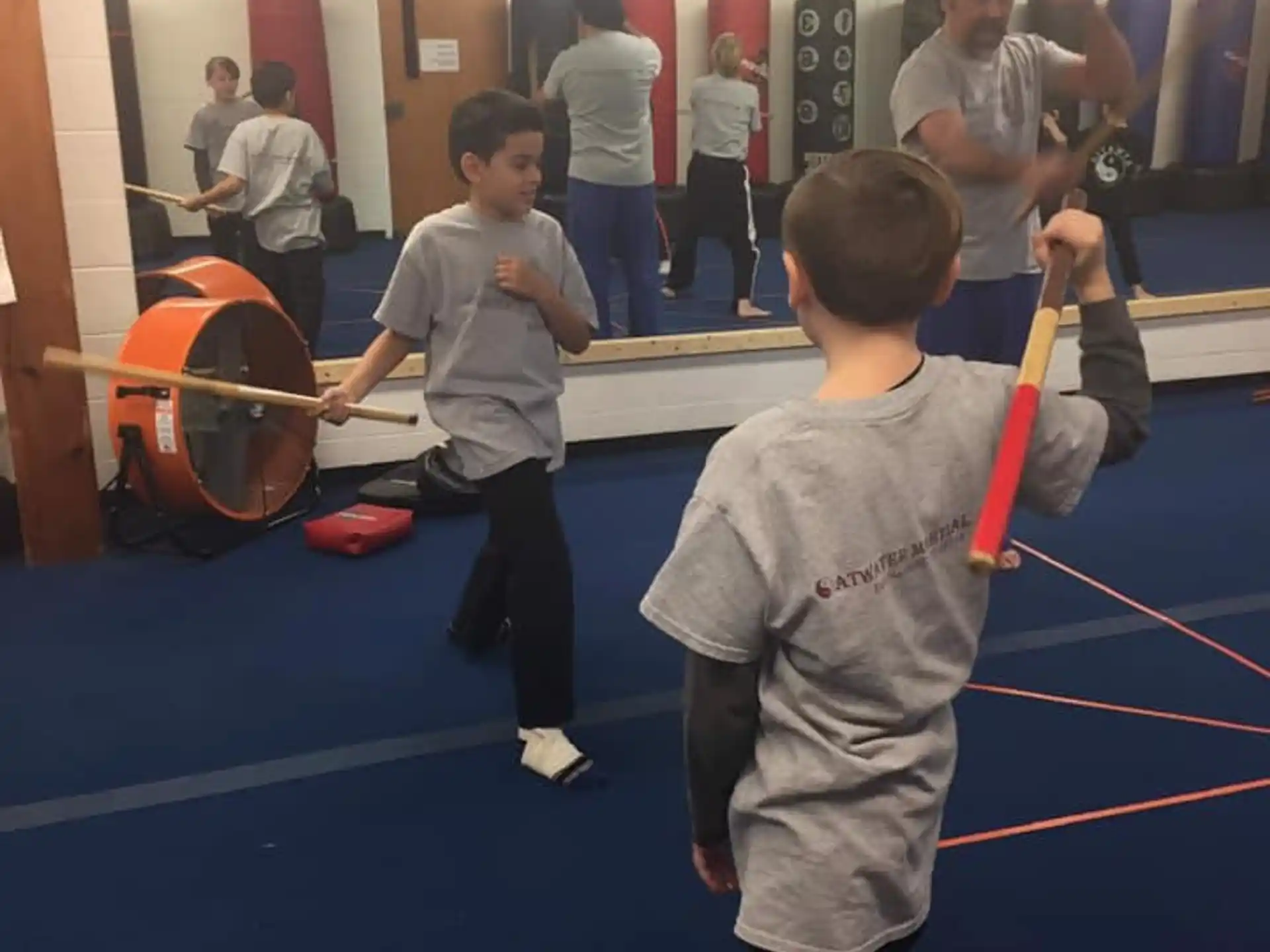 a group of kids playing with a ball in a gym