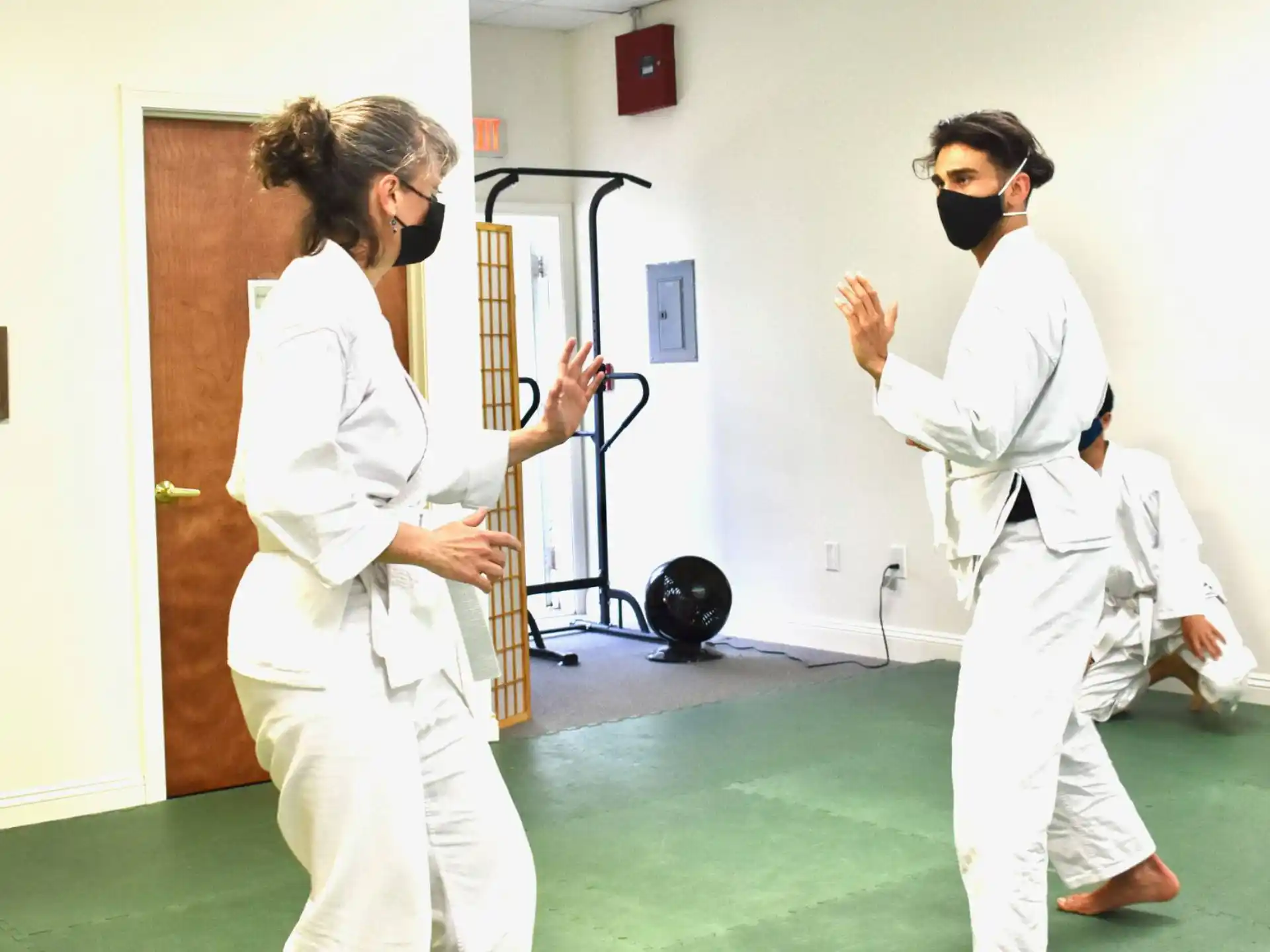 a couple of people wearing white uniforms
