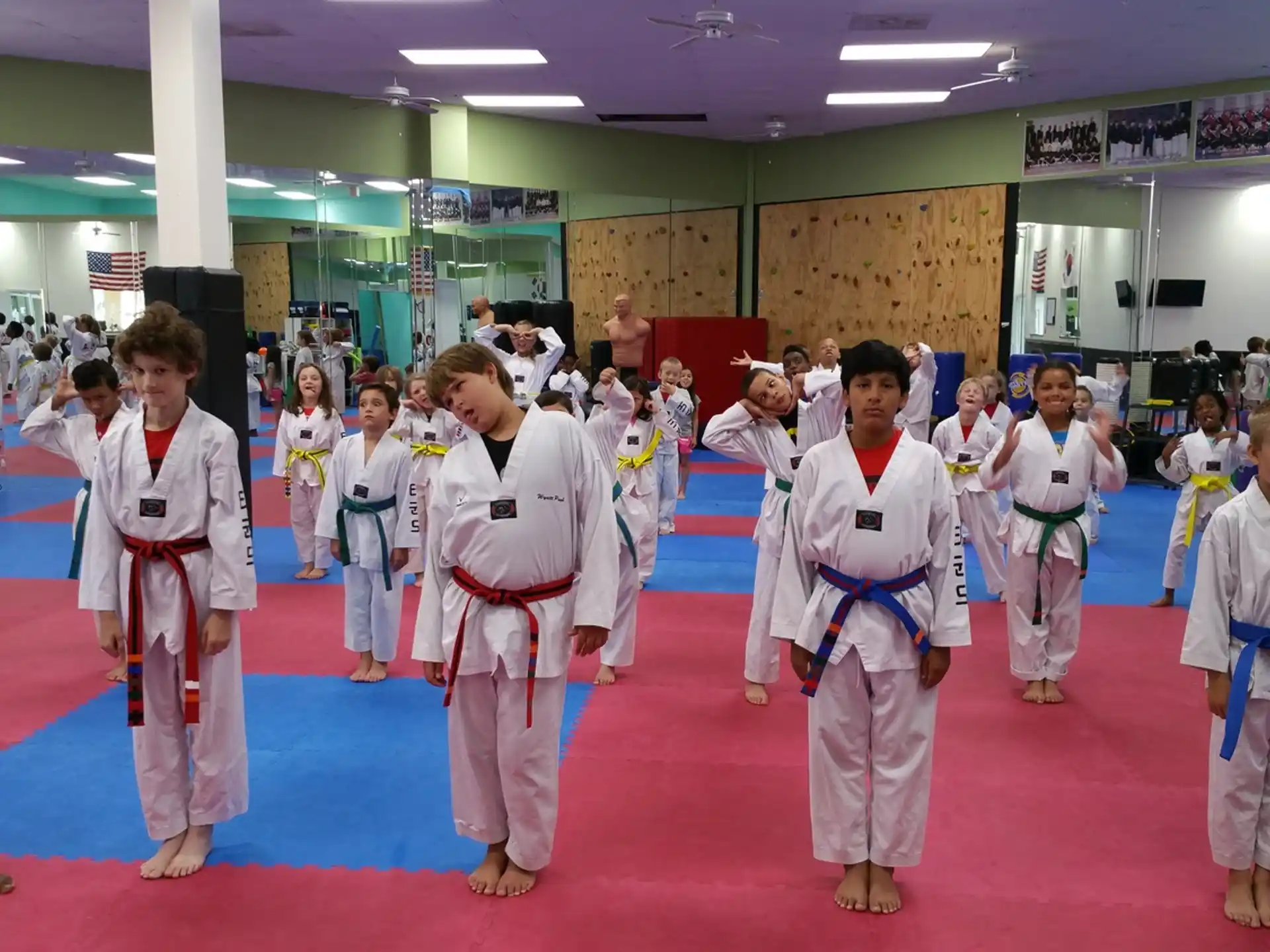a group of people in karate uniforms