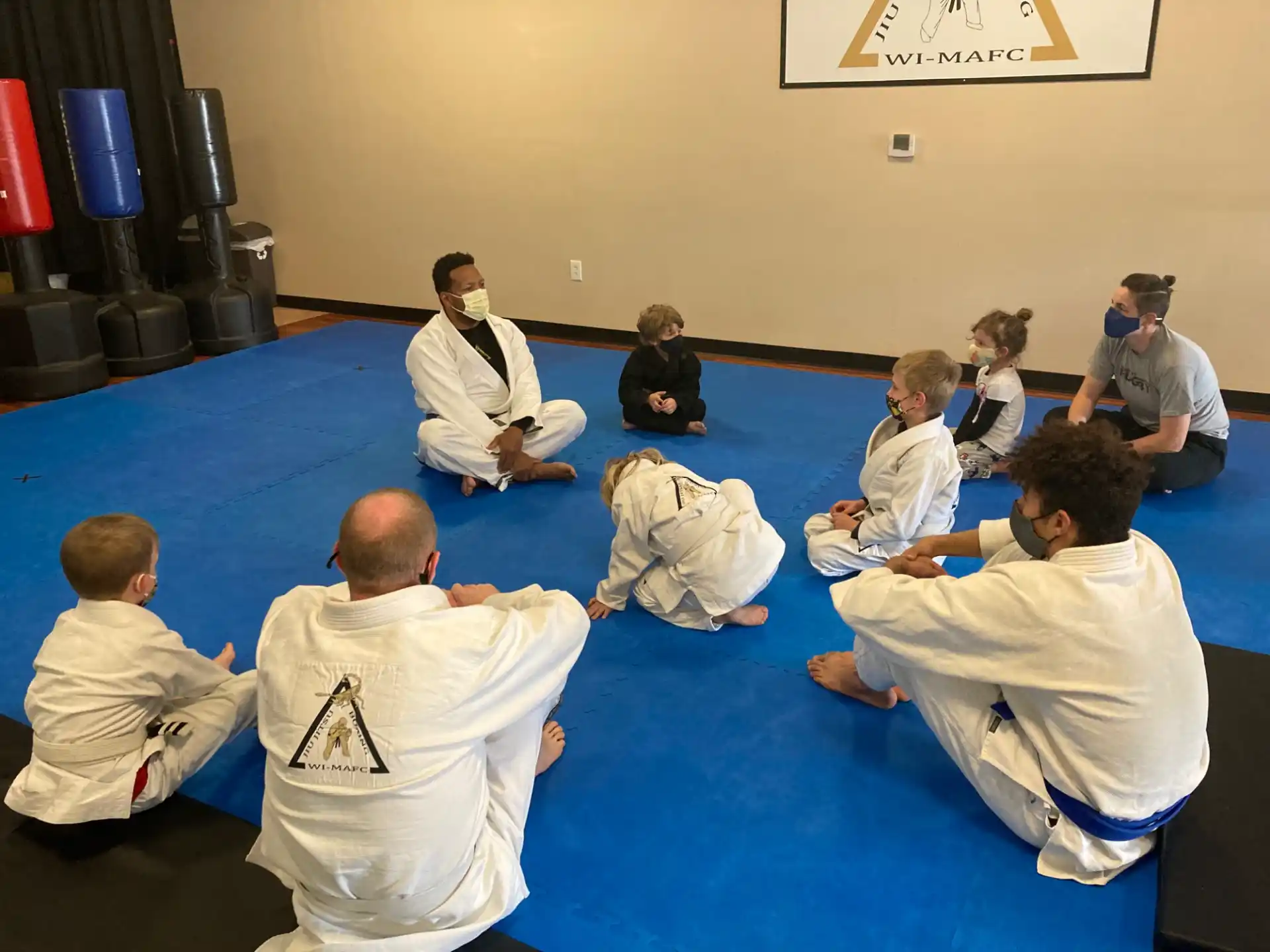 a group of people sitting on the floor