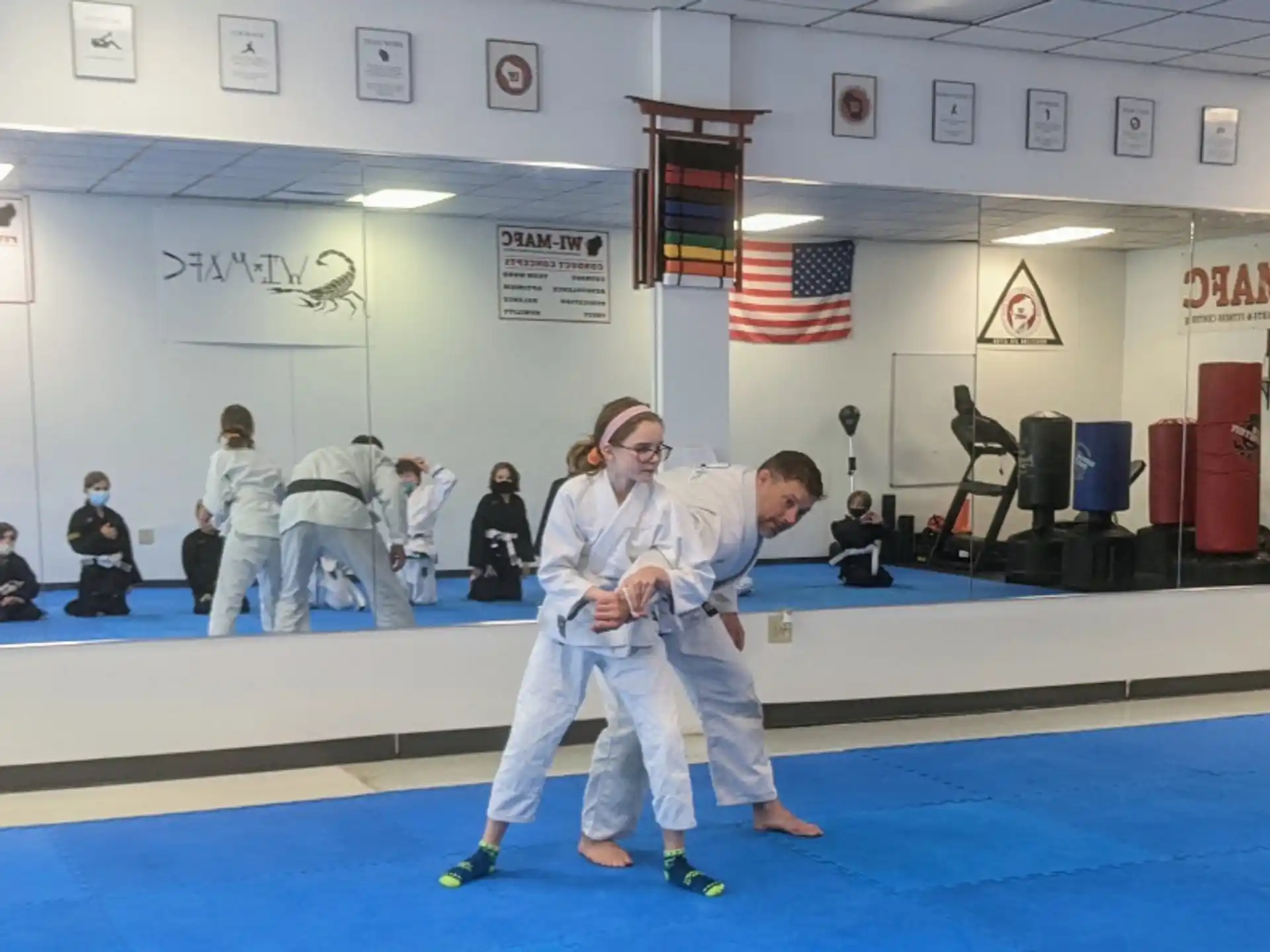 a man and woman in karate uniforms