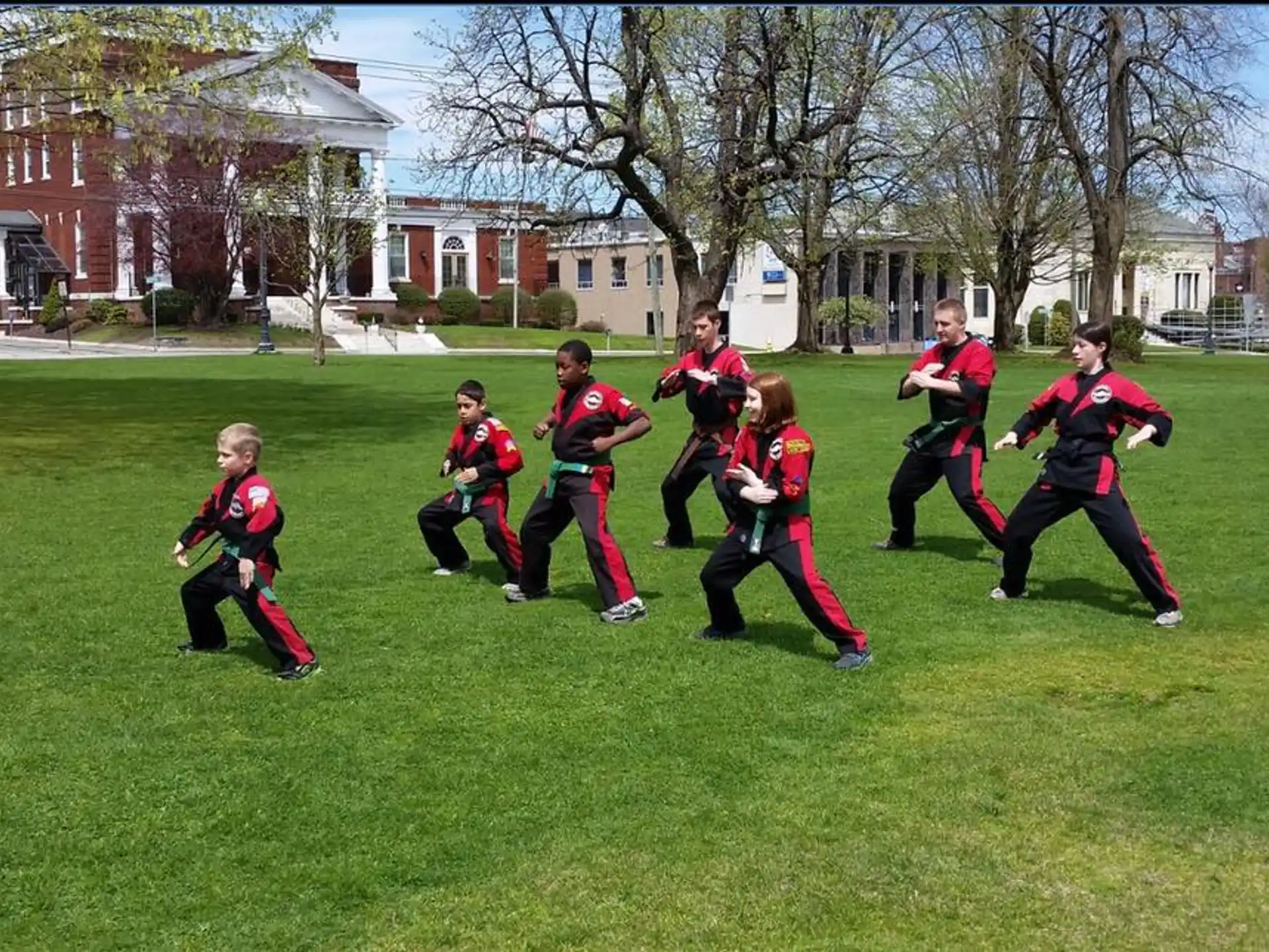 a group of people in uniform running on a field