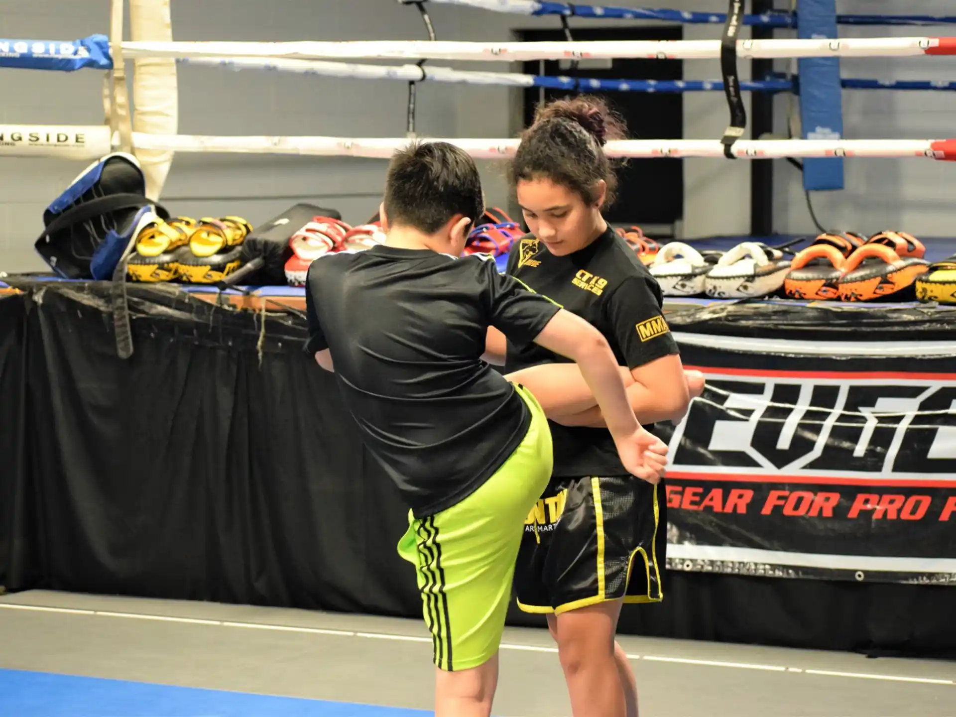 two boys in a wrestling ring