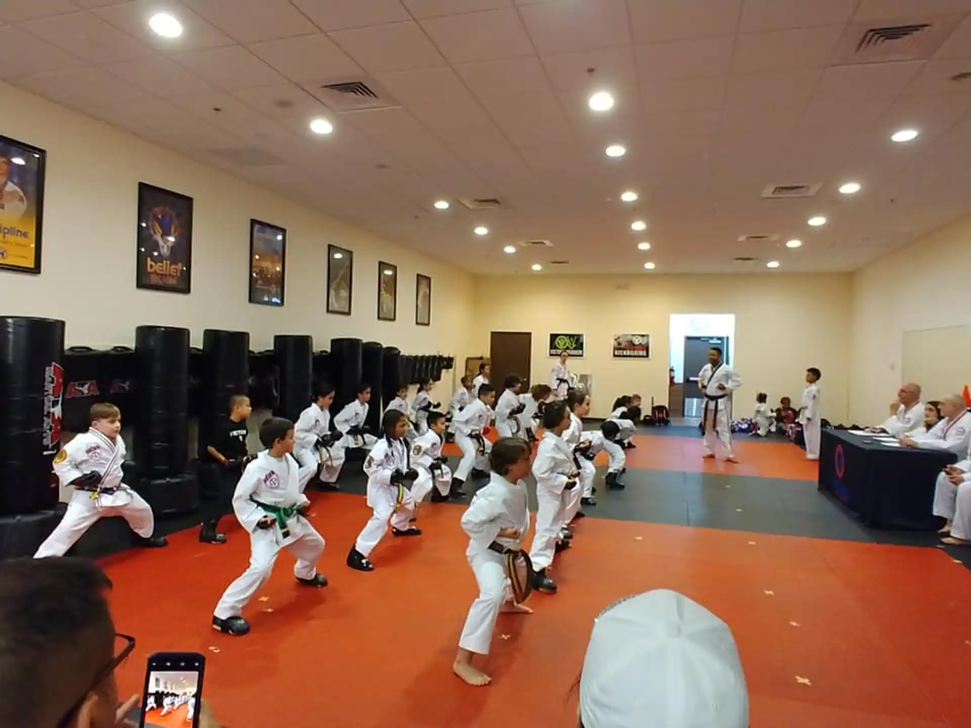 a group of people in karate uniforms