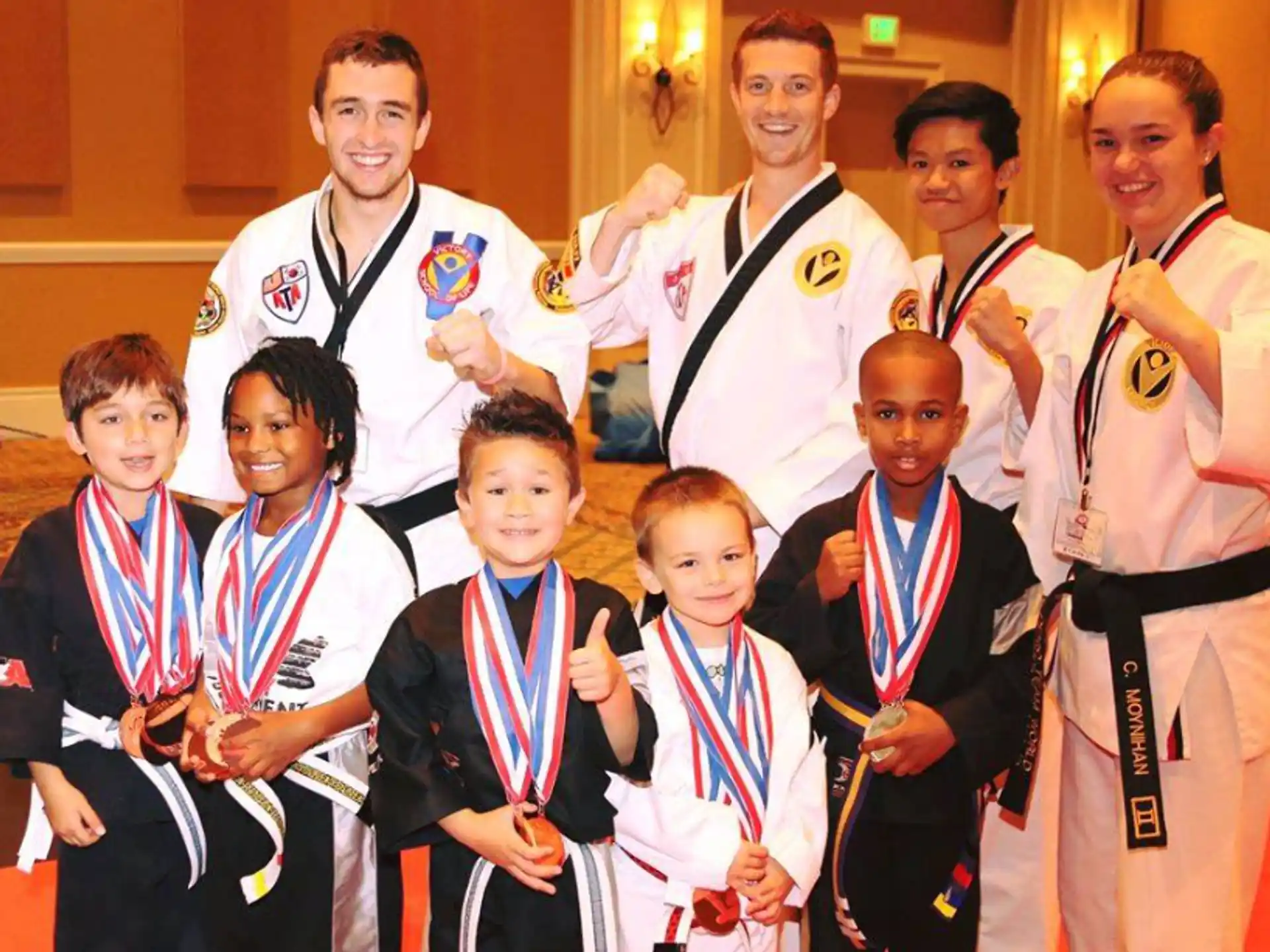 a group of people wearing medals