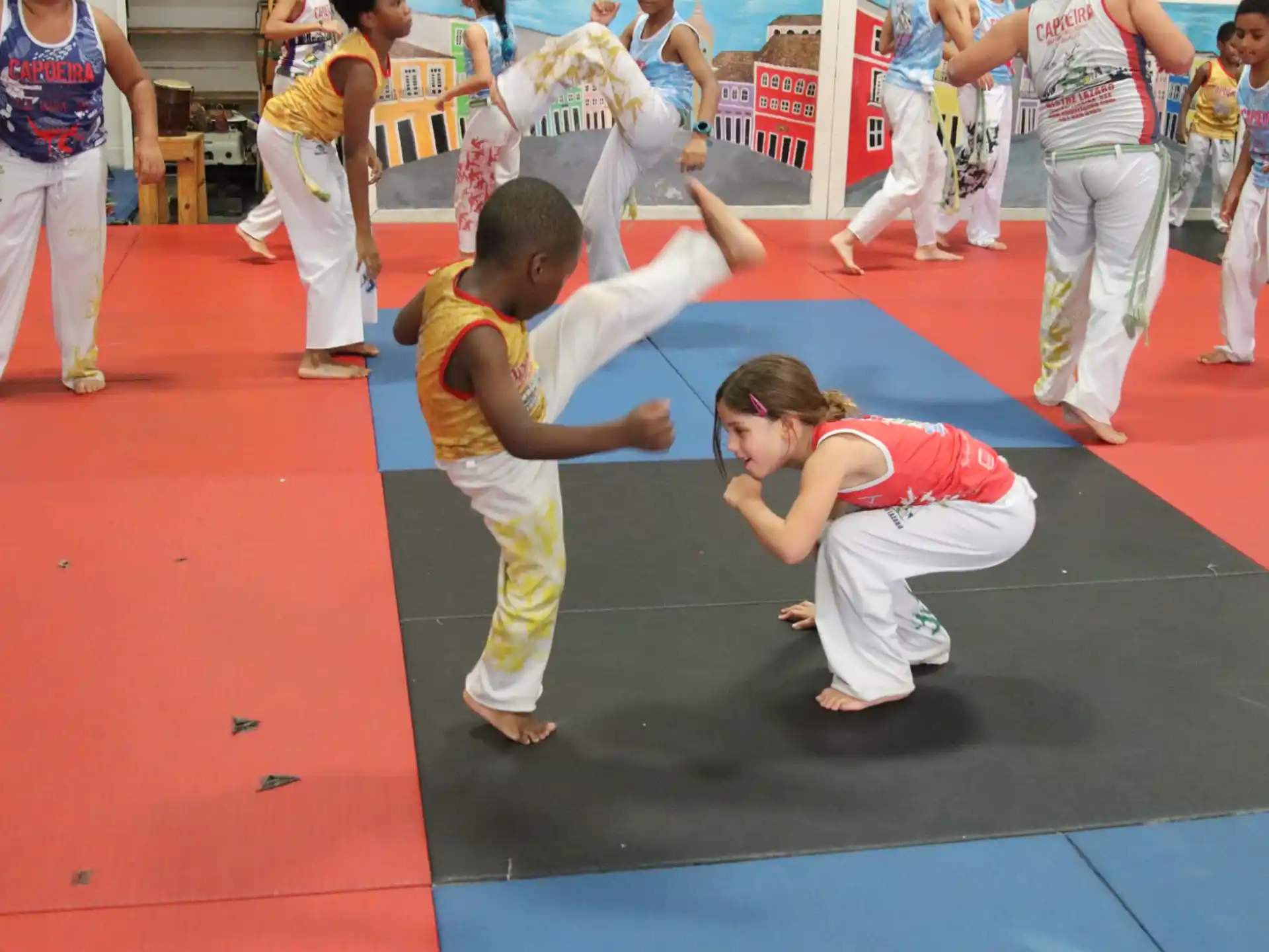 a group of children in karate uniforms
