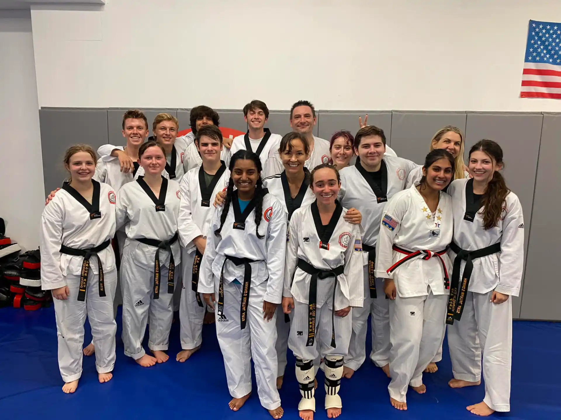 a group of people in karate uniforms