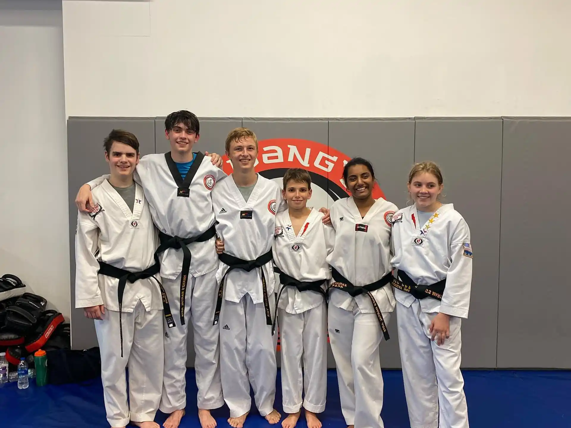 a group of people in karate uniforms