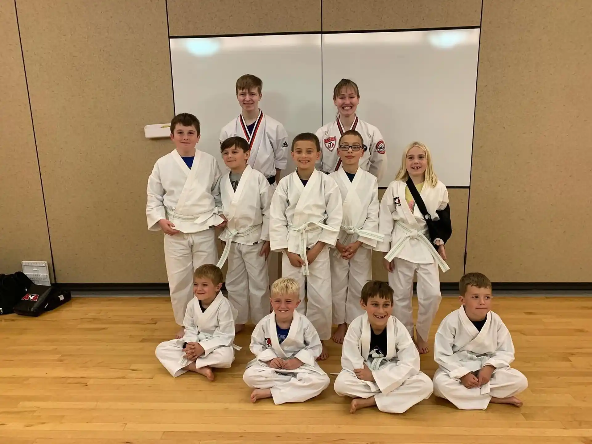 a group of people in karate uniforms