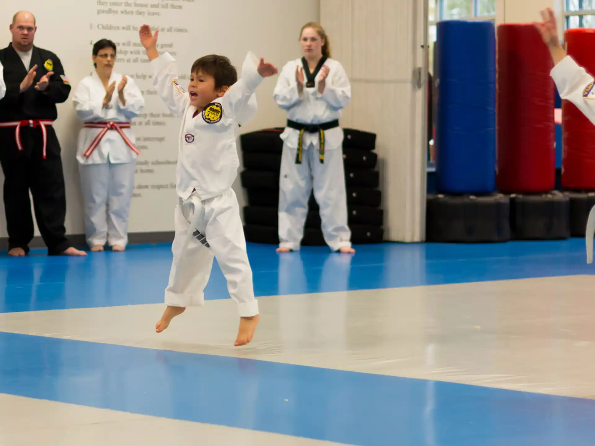 a group of people in karate uniforms