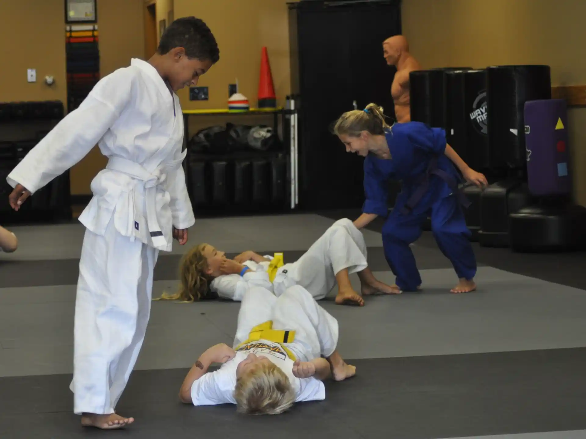 a group of people in karate uniforms