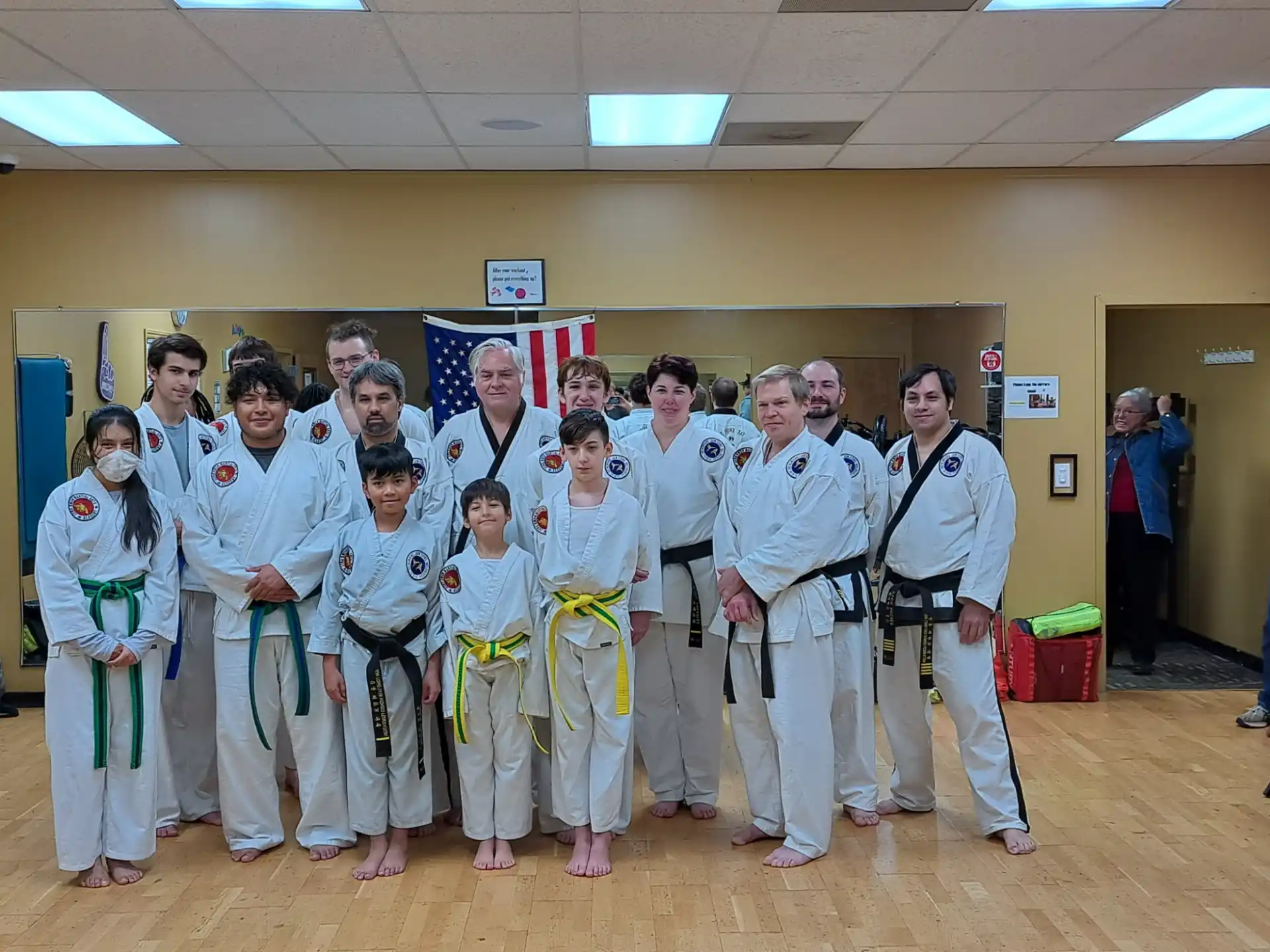 a group of people in karate uniforms