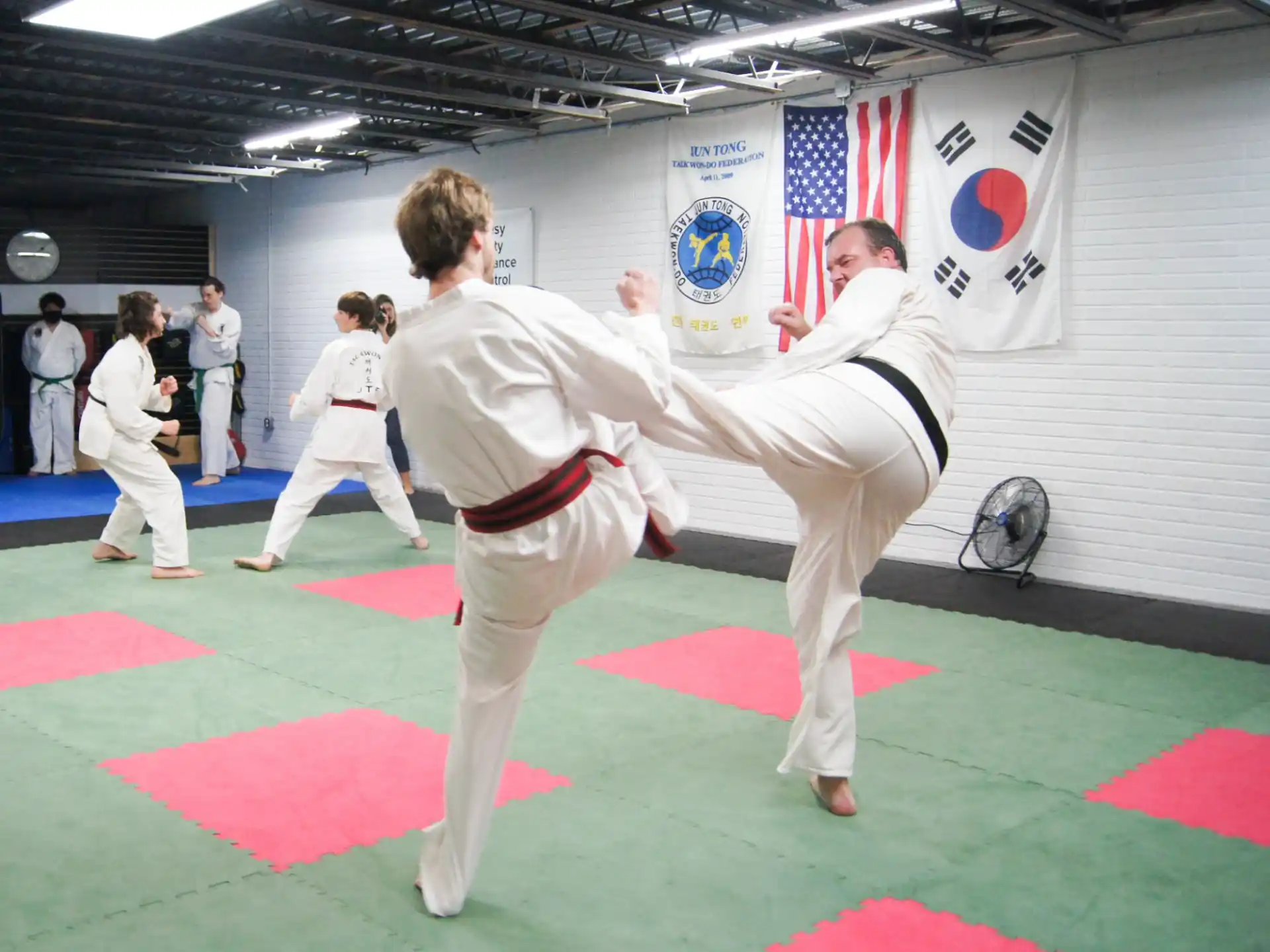 a group of people in karate uniforms