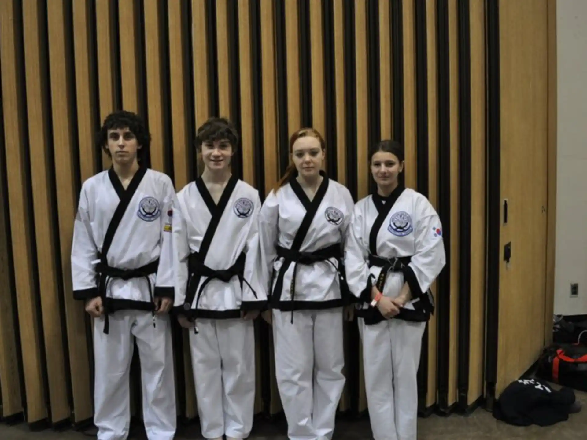 a group of men in karate uniforms