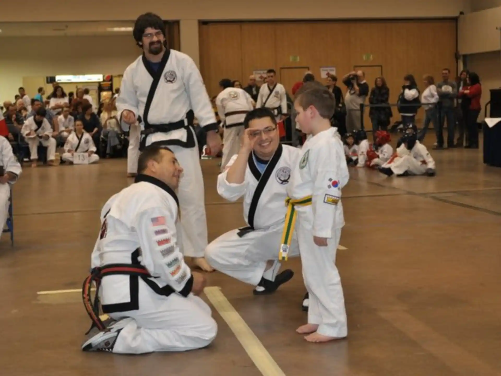 a group of people in karate uniforms