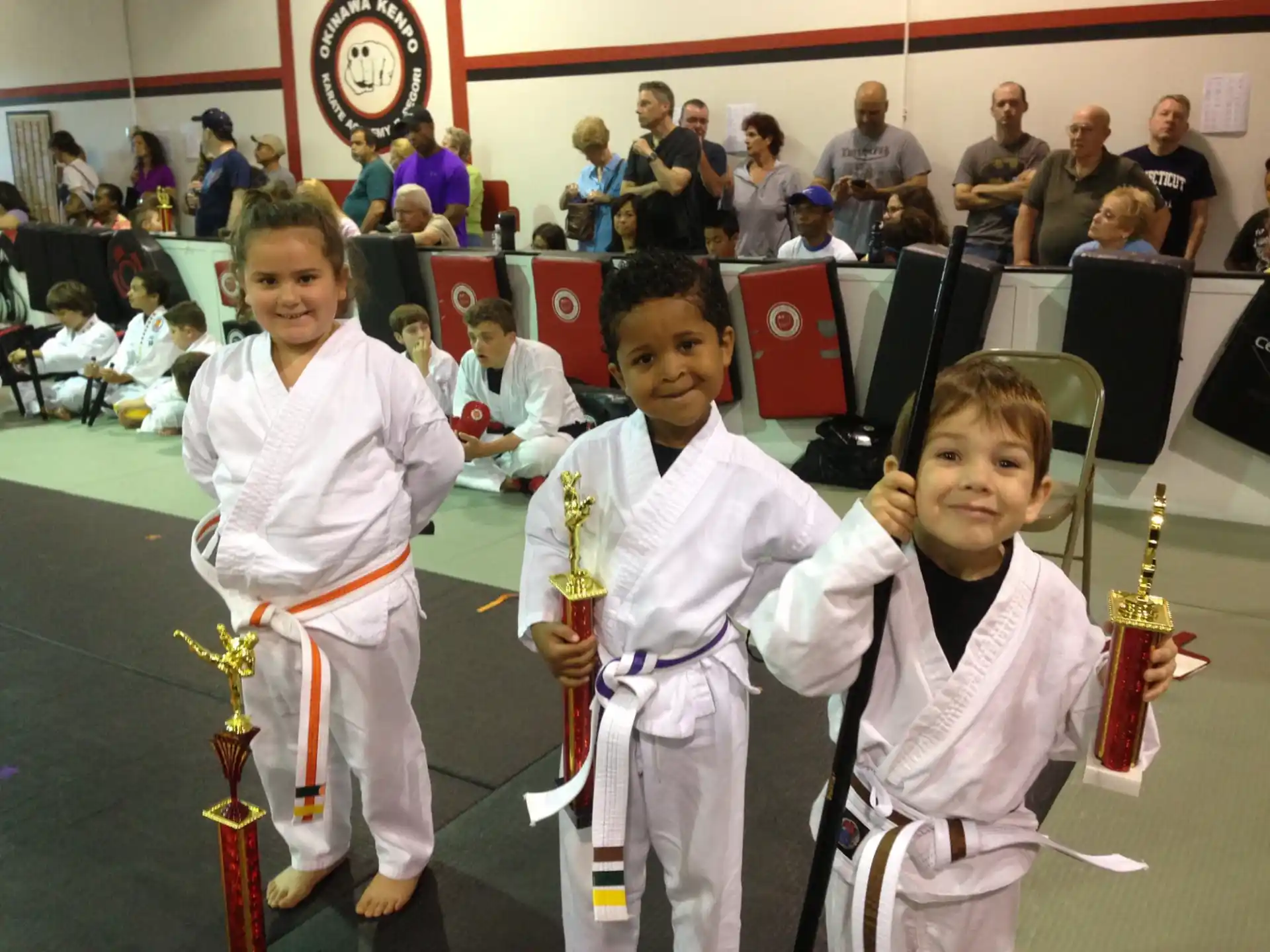 a group of girls in karate uniforms