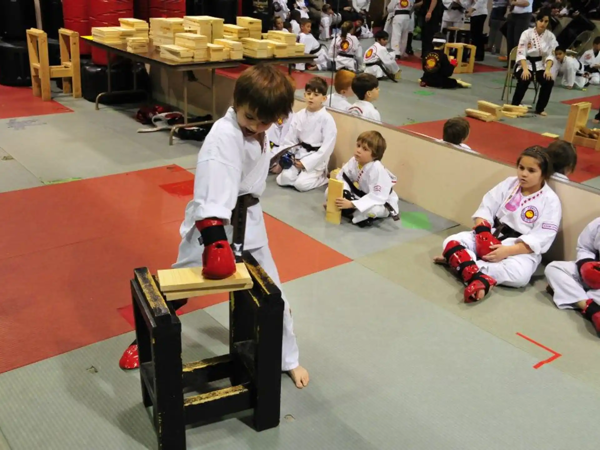 a group of kids in karate uniforms