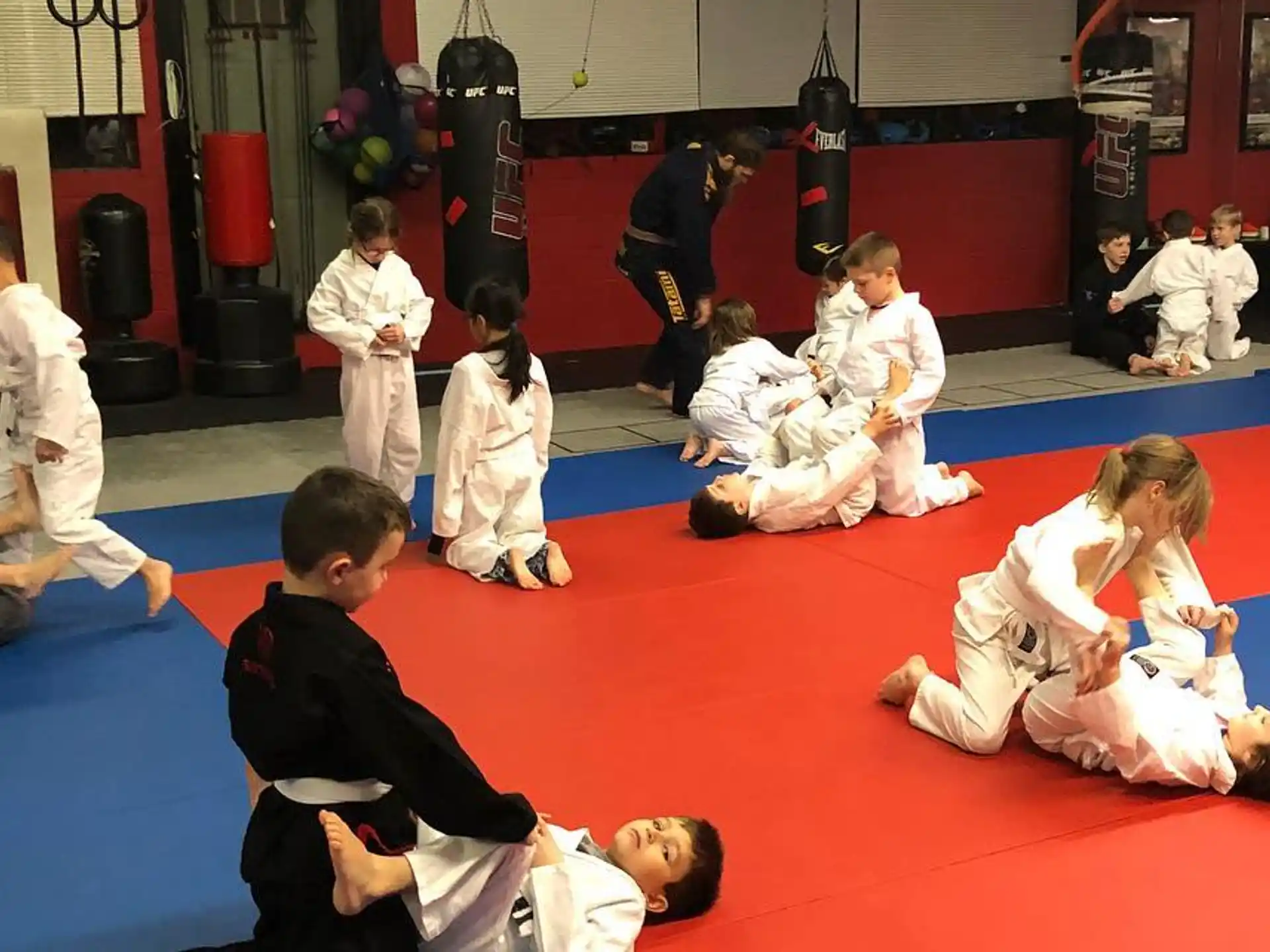 a group of people in karate uniforms