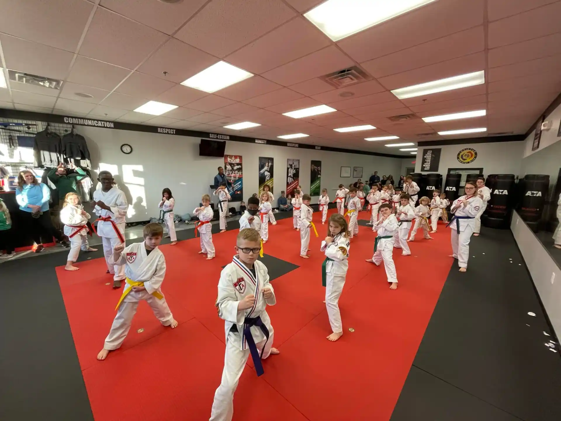 a group of people in karate uniforms