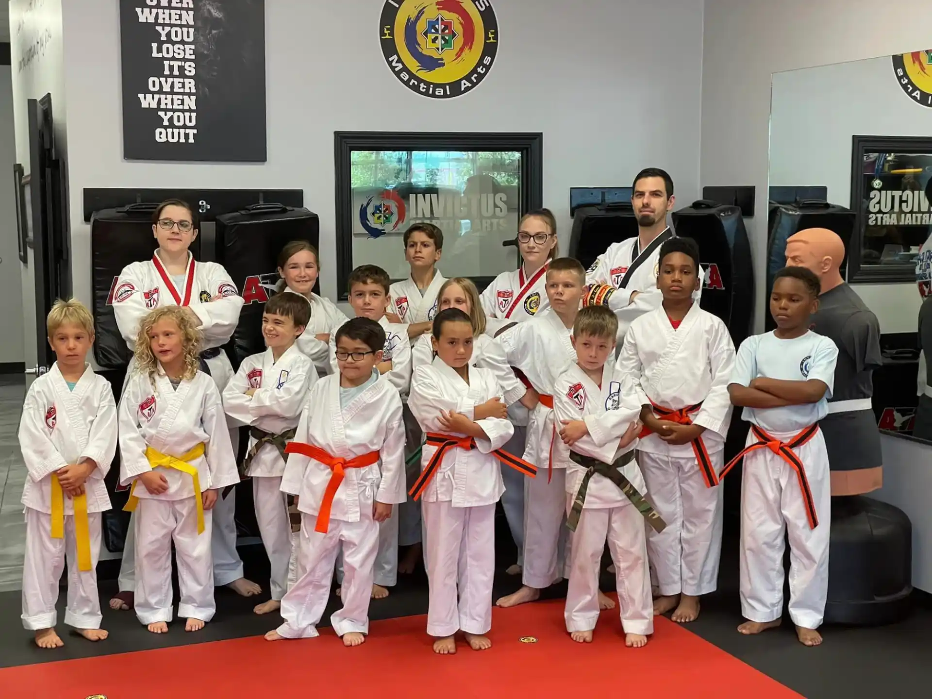 a group of people in karate uniforms