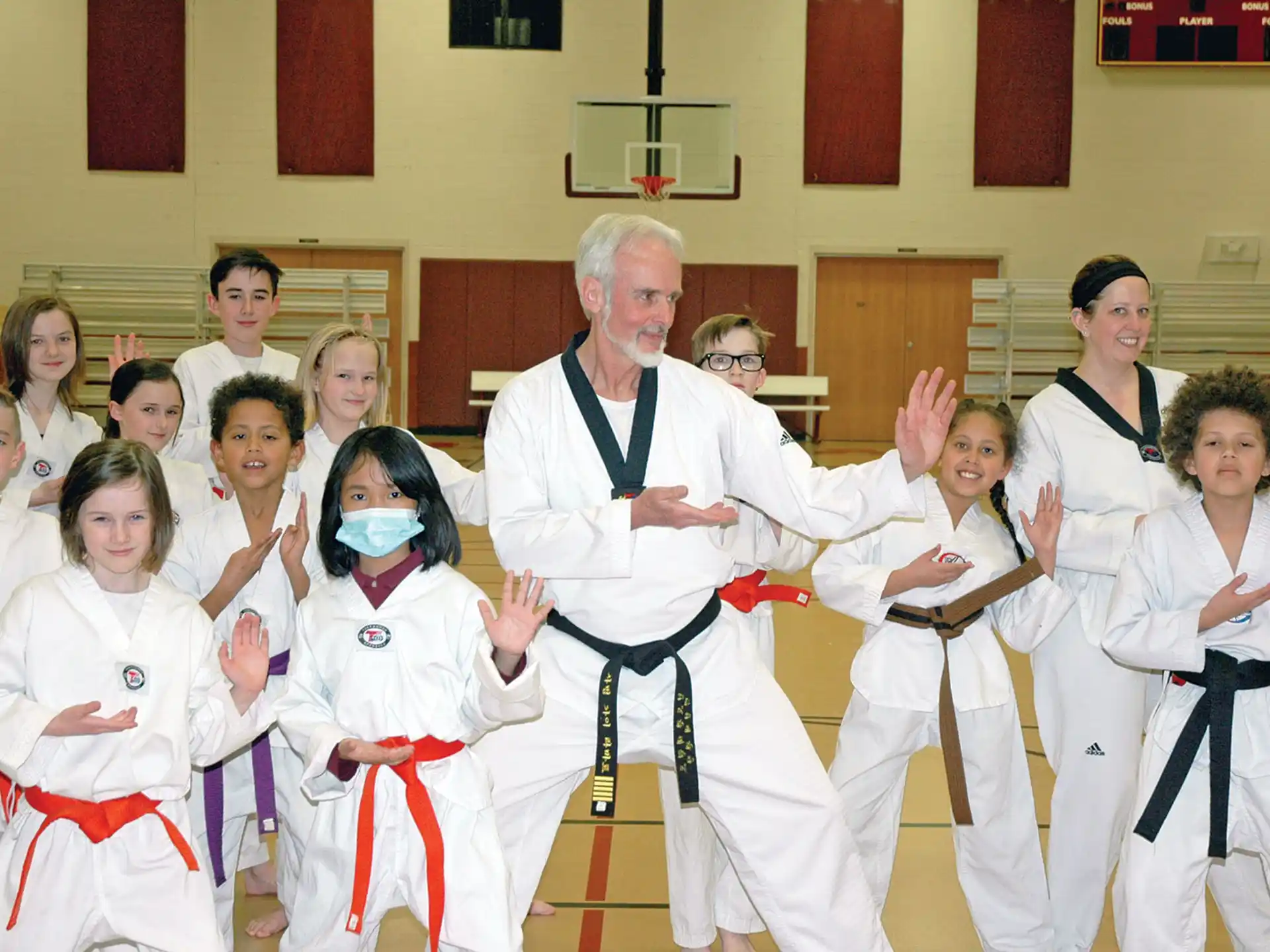 a group of people in karate uniforms