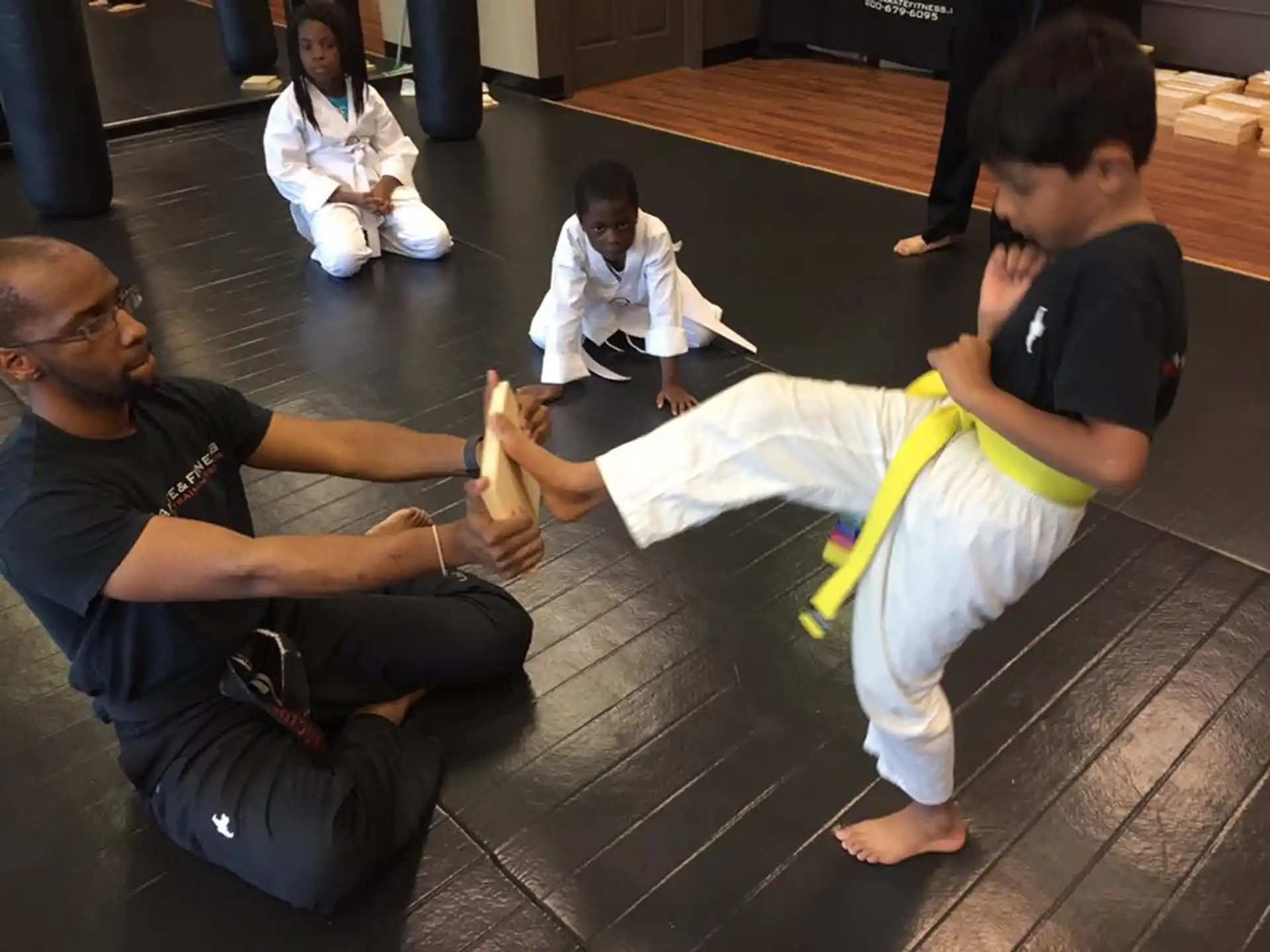 a group of people sitting on the floor