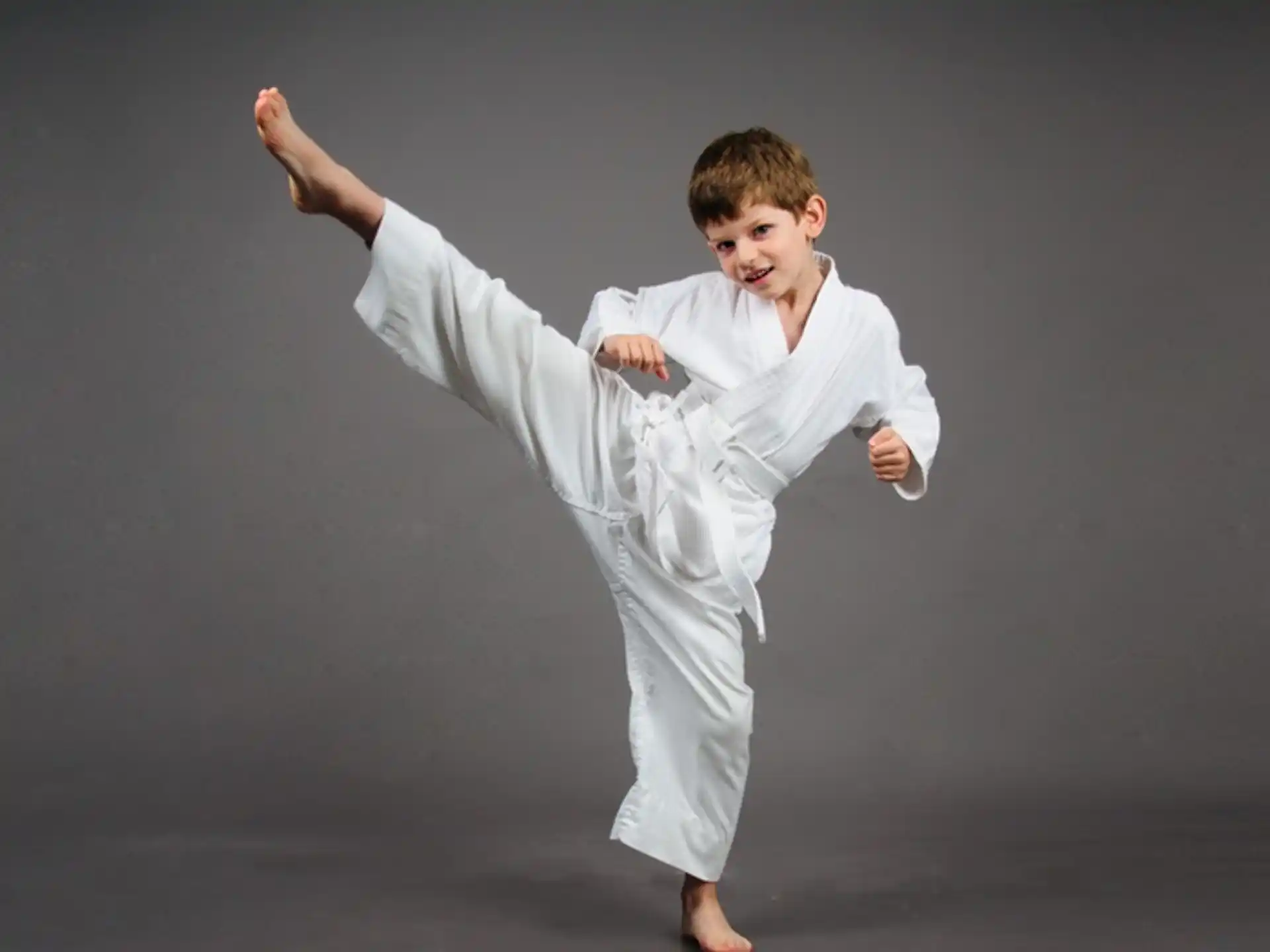 a boy in a karate uniform