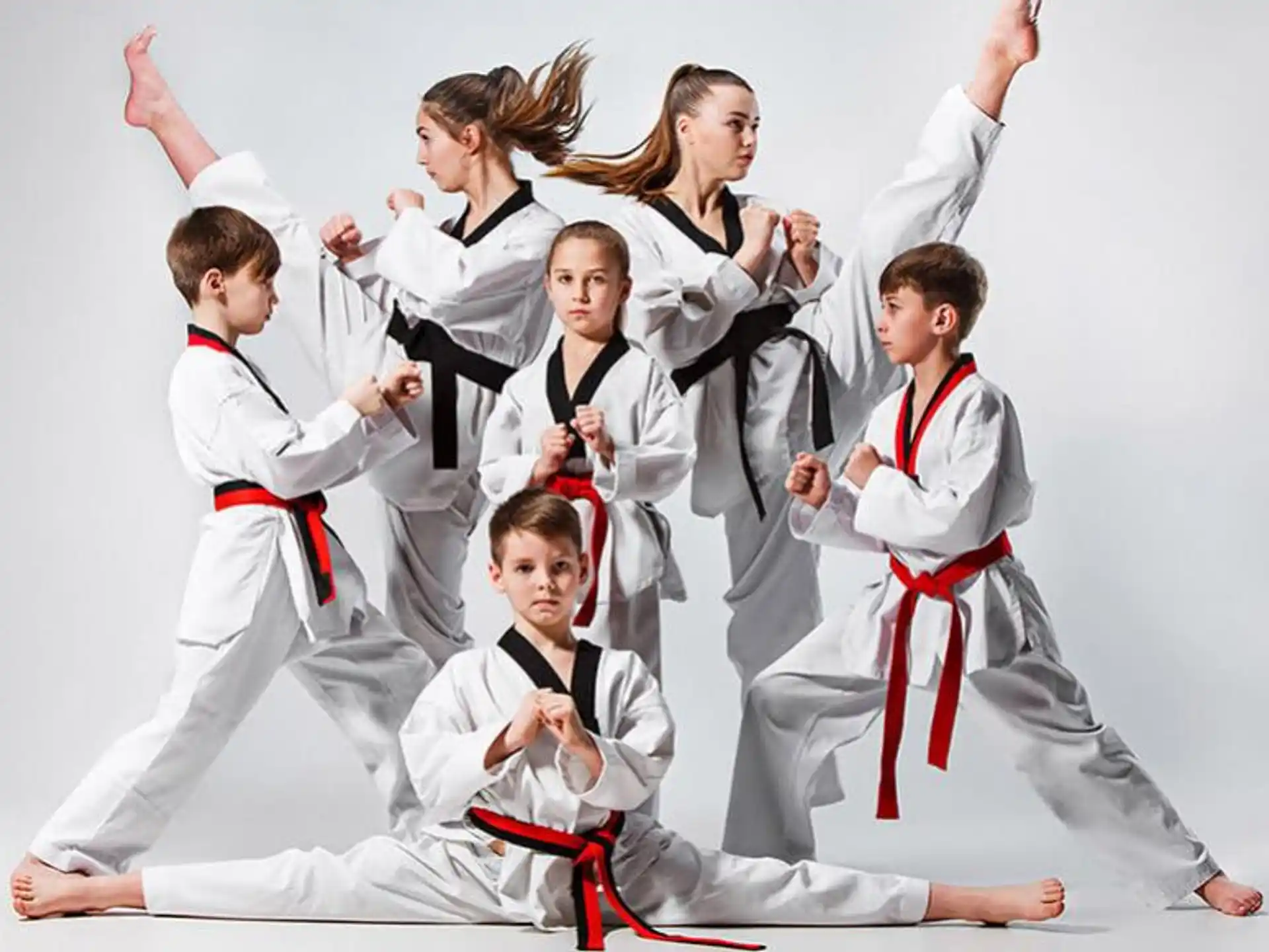 a group of people in karate uniforms