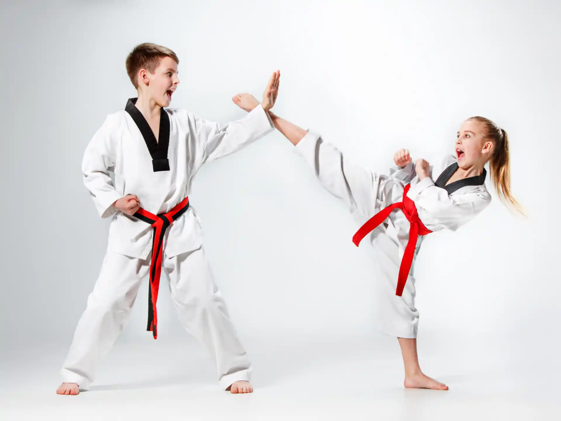 a man and a woman in karate uniforms